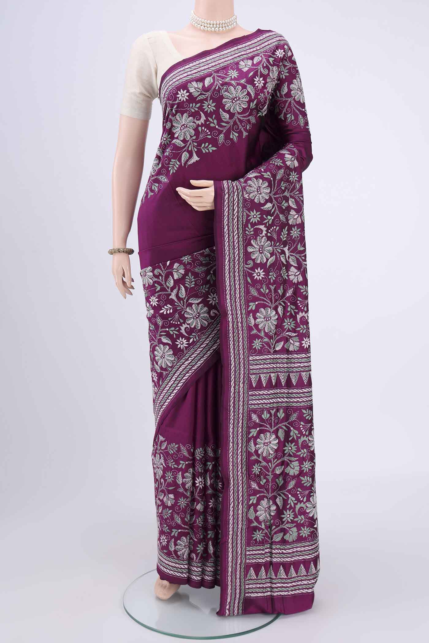 Magenta Kantha Silk Saree with Kantha Work on the body and Thread Border.  displayed on a mannequin