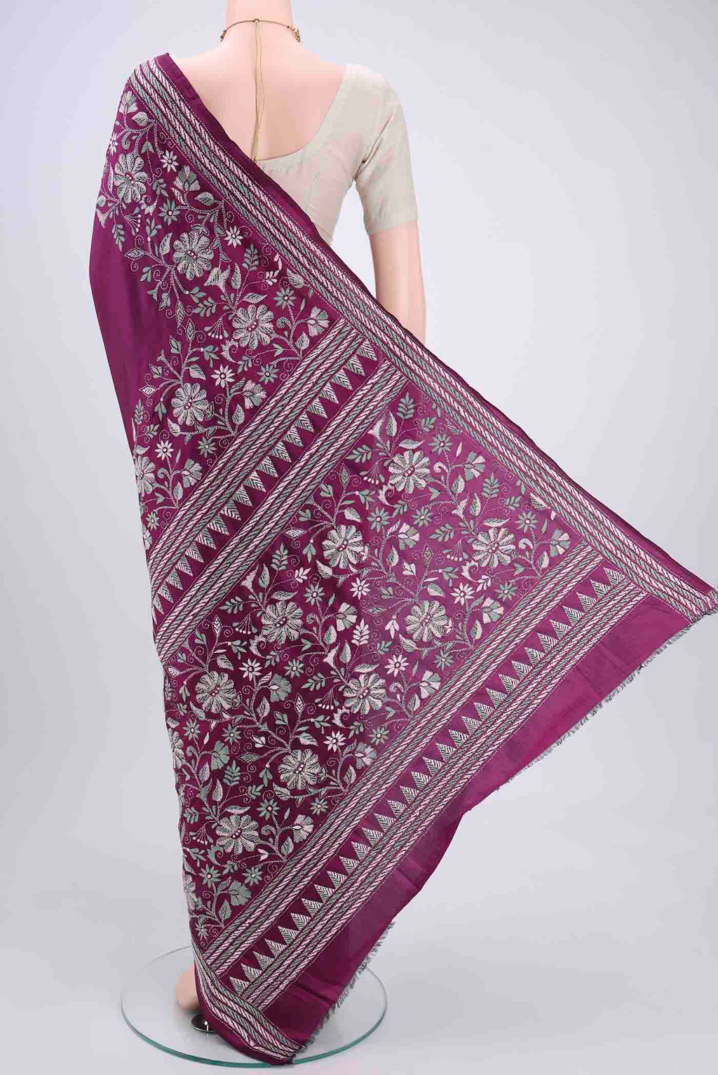 Flat view of Magenta Kantha Silk Saree with Kantha Work on the body and Thread Border. 