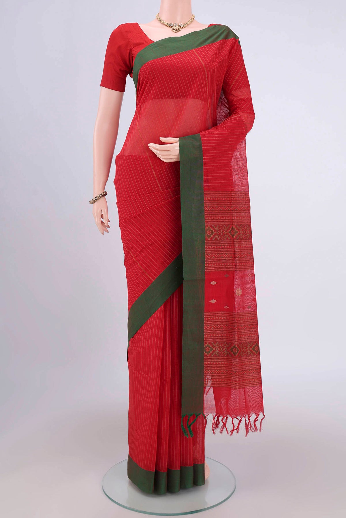 Red Coimbatore Cotton Saree with Stripes on the body and Zari Border.  displayed on a mannequin
