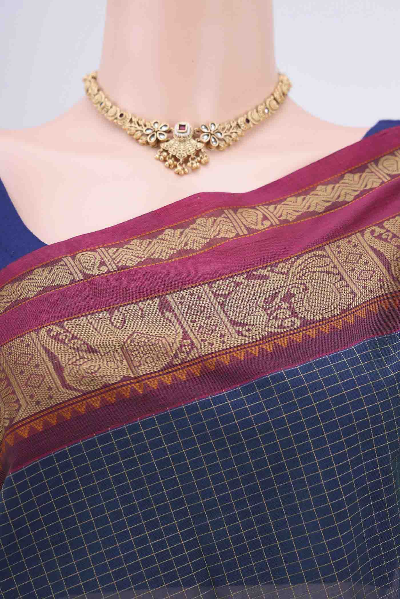 Border image of Blue Coimbatore Cotton Saree with Checked design on the body and Plain Border. 