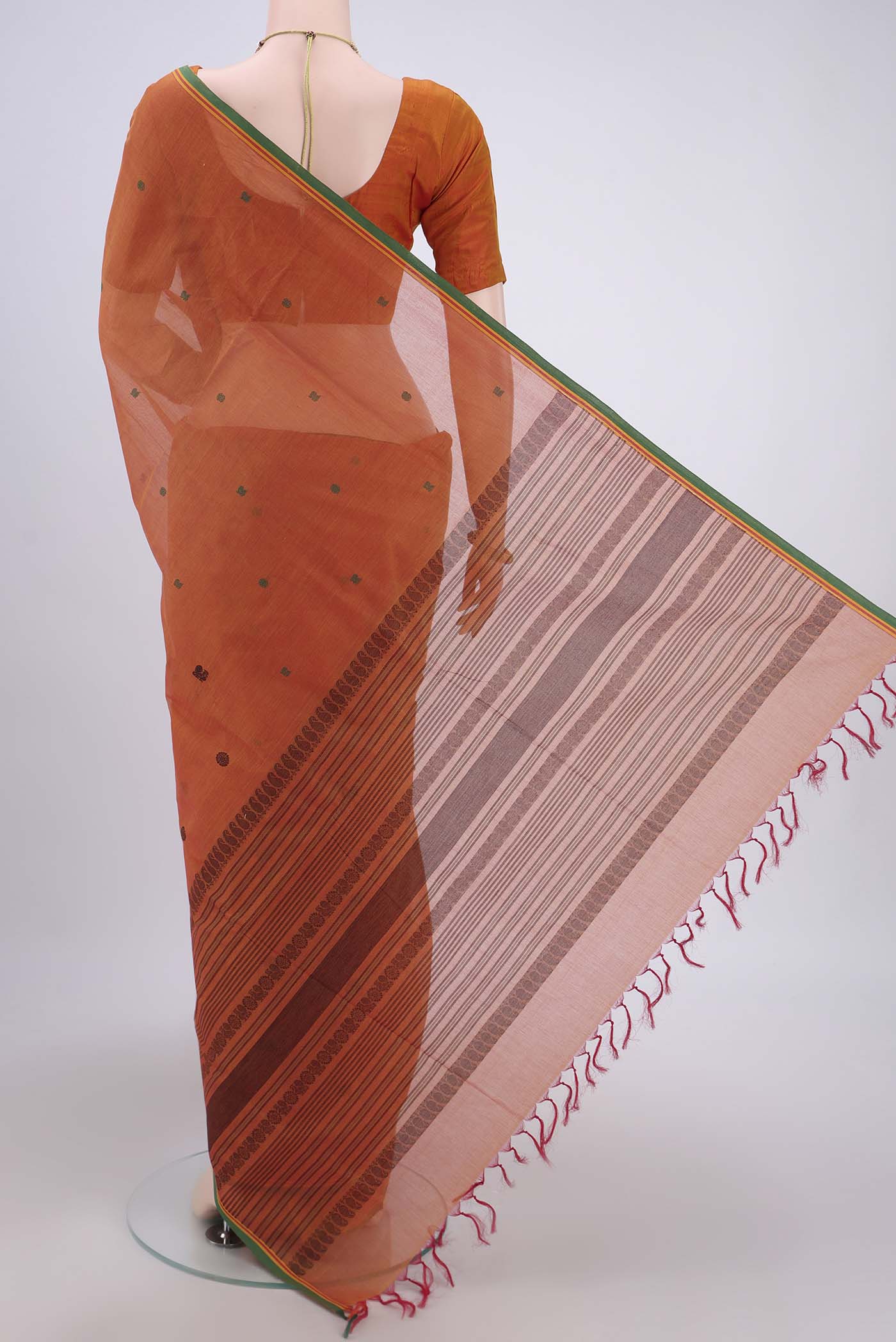 Flat view of Mustard Coimbatore Cotton Saree with Thread Butta on the body and Zari Border. 