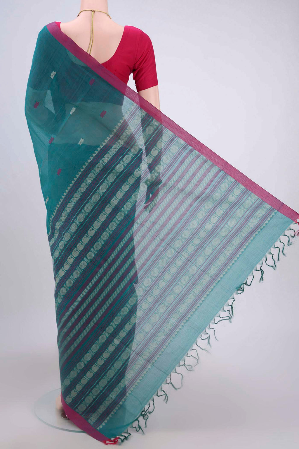 Flat view of Sea Green Coimbatore Cotton Saree with Thread Butta on the body and Zari Border. 