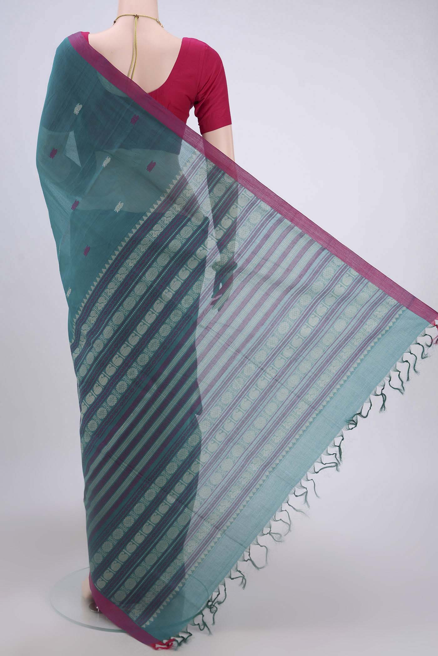 Flat view of Sea Green Coimbatore Cotton Saree with Thread Butta on the body and Zari Border. 