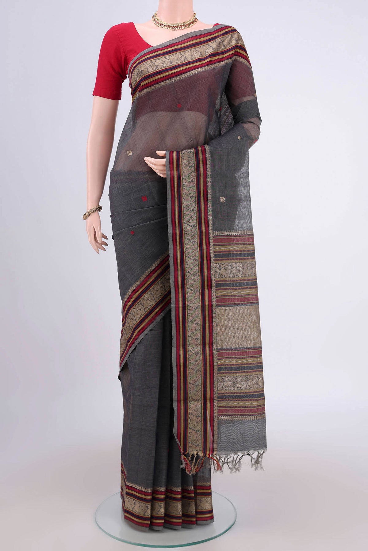 Grey Kanchi Cotton Saree with Plain Body and Thread Border.  displayed on a mannequin