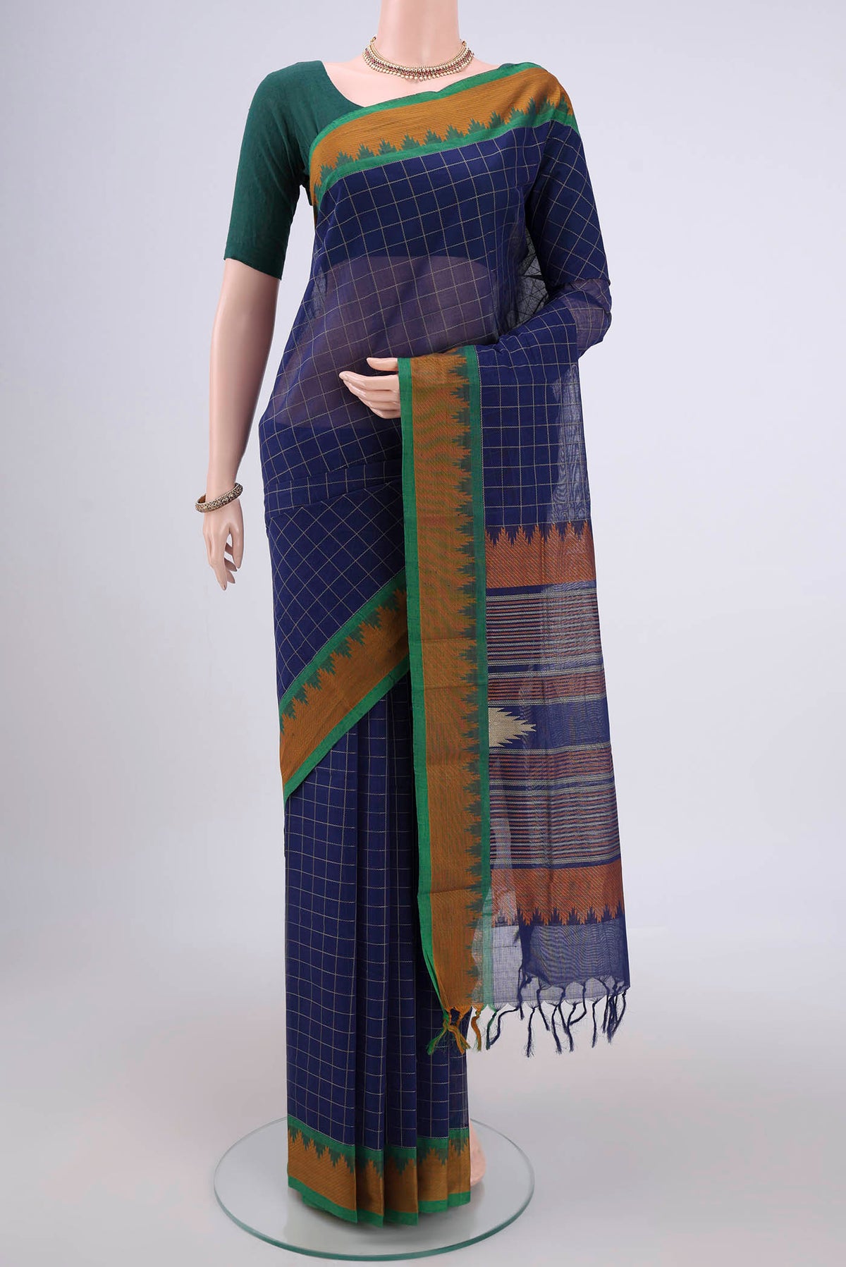 Royal Blue Kanchi Cotton Saree with Checked design on the body and Thread Border.  displayed on a mannequin