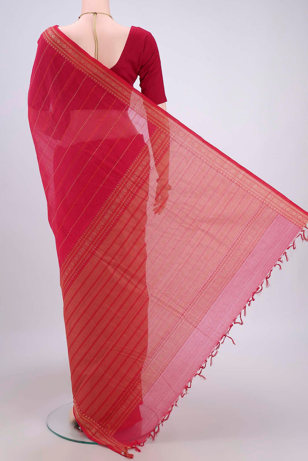 Flat view of Dark Pink Kanchi Cotton Saree with Stripes on the body and Zari Border. 