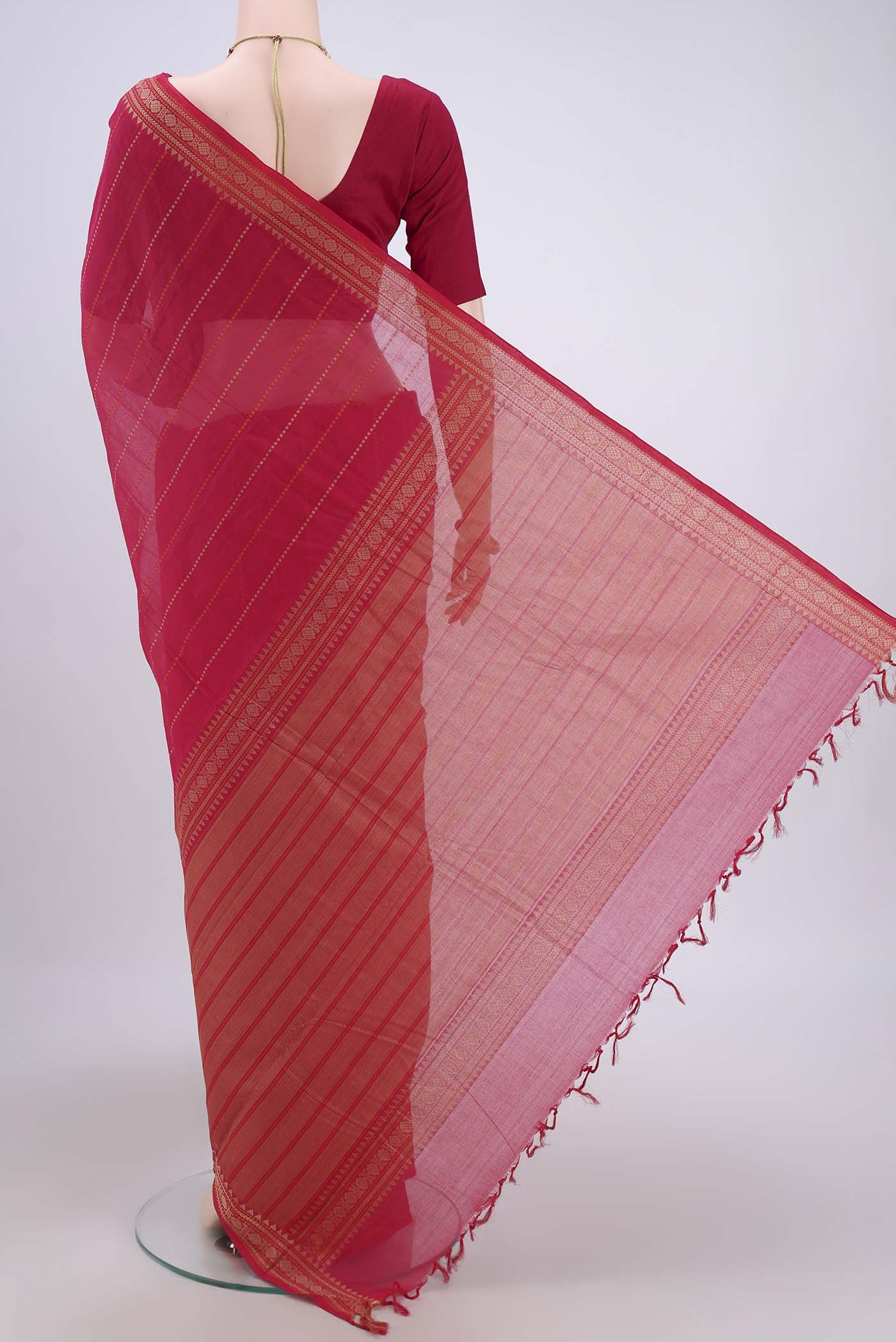 Flat view of Dark Pink Kanchi Cotton Saree with Stripes on the body and Zari Border. 