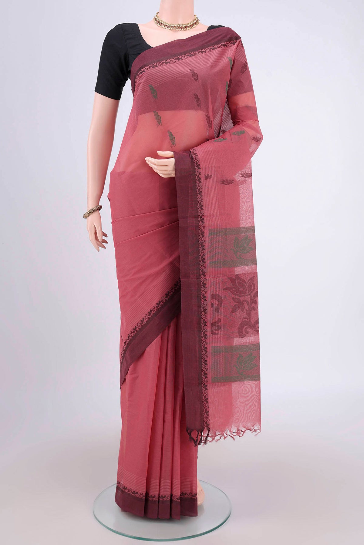 Coral Kanchi Cotton Saree with Thread Butta on the body and Thread Border.  displayed on a mannequin
