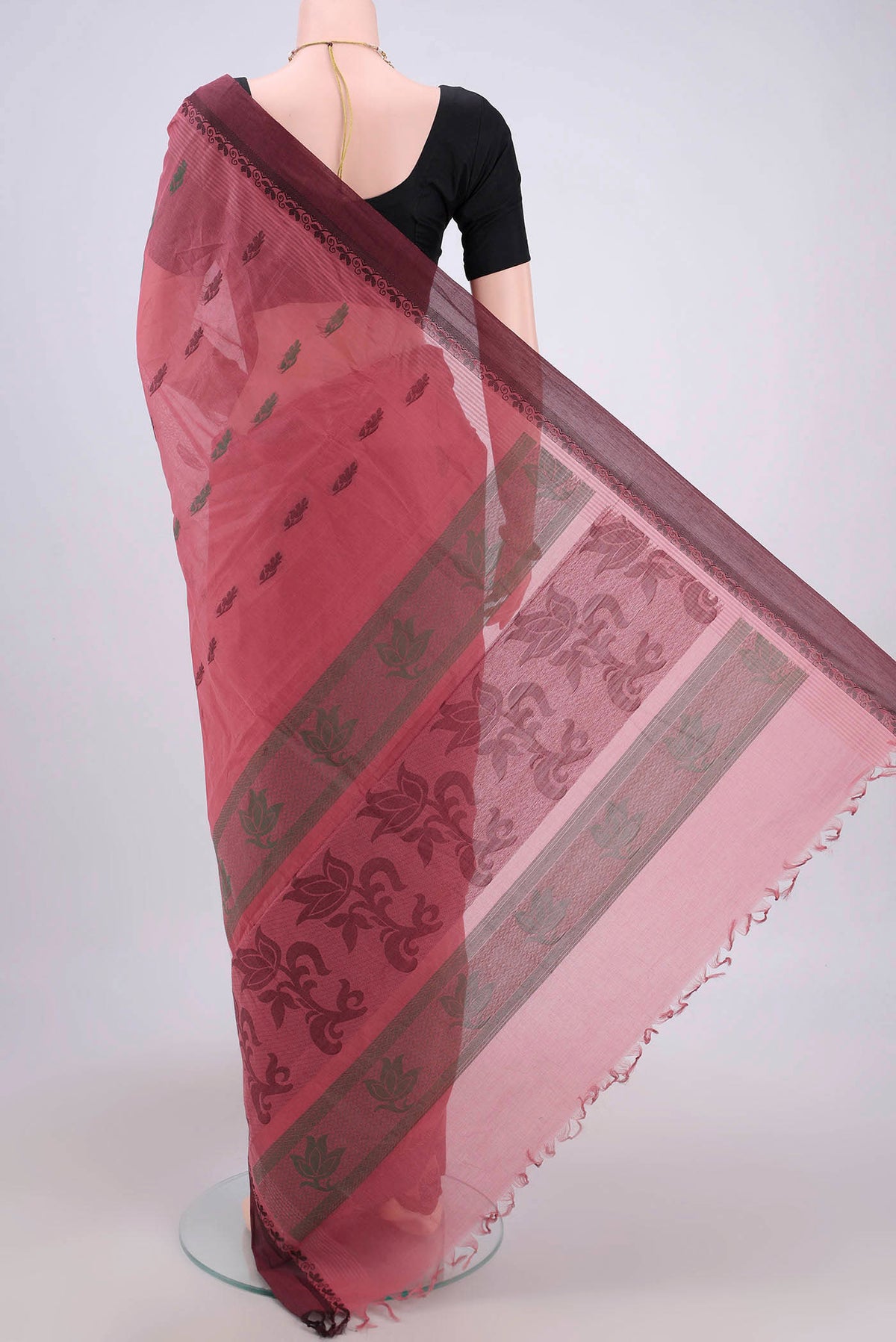 Flat view of Coral Kanchi Cotton Saree with Thread Butta on the body and Thread Border. 