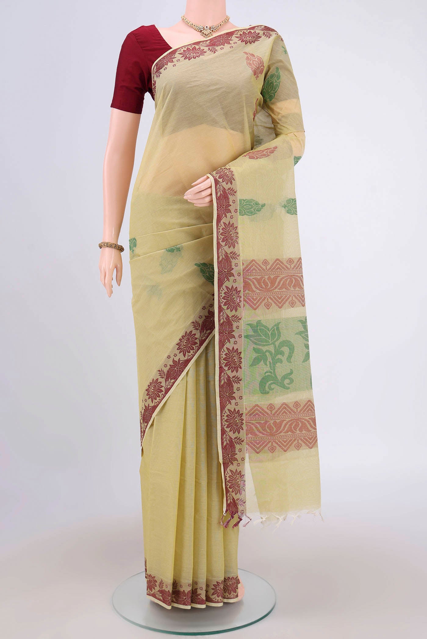 Lemon Yellow Kanchi Cotton Saree with Thread Butta on the body and Thread Border.  displayed on a mannequin