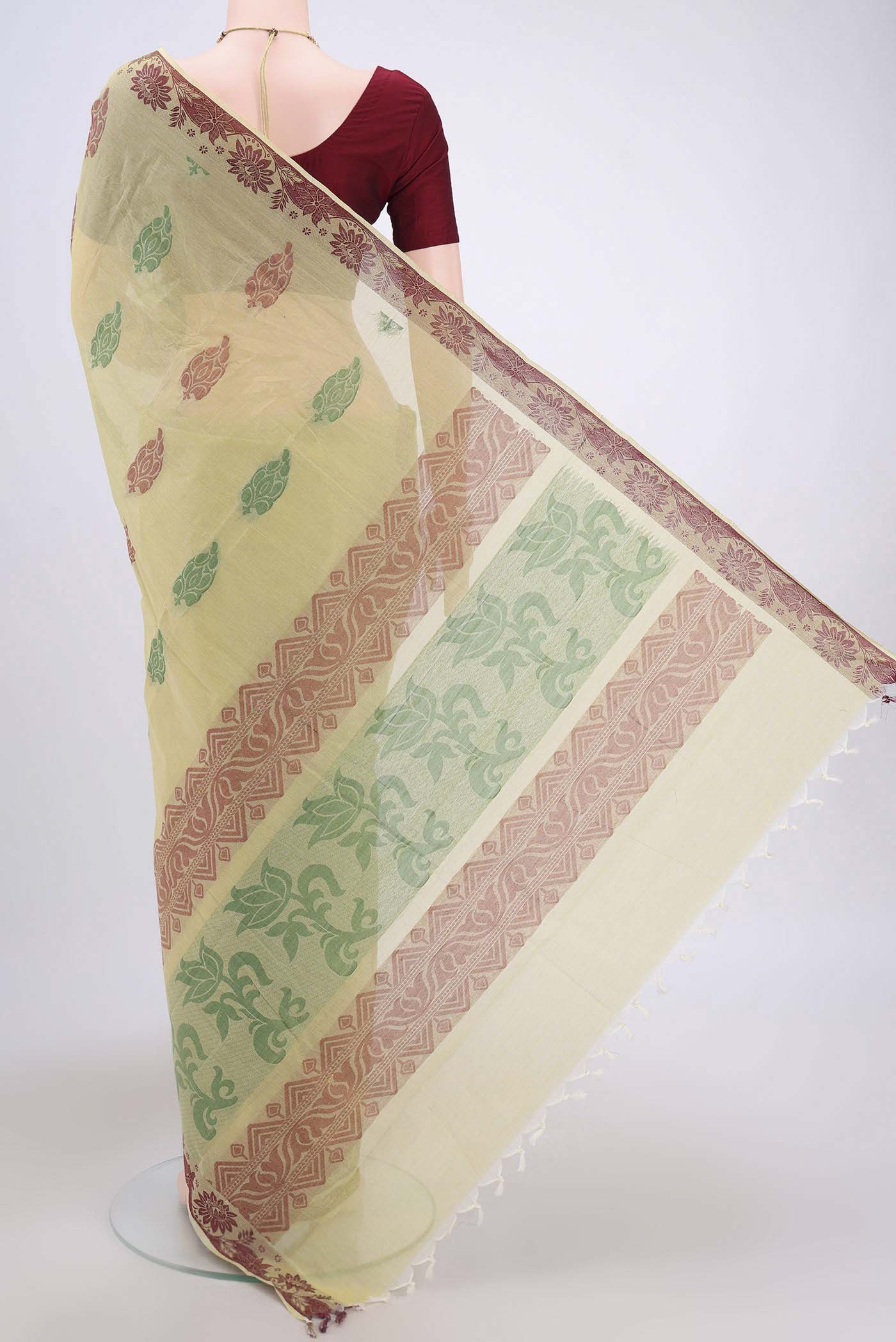 Flat view of Lemon Yellow Kanchi Cotton Saree with Thread Butta on the body and Thread Border. 