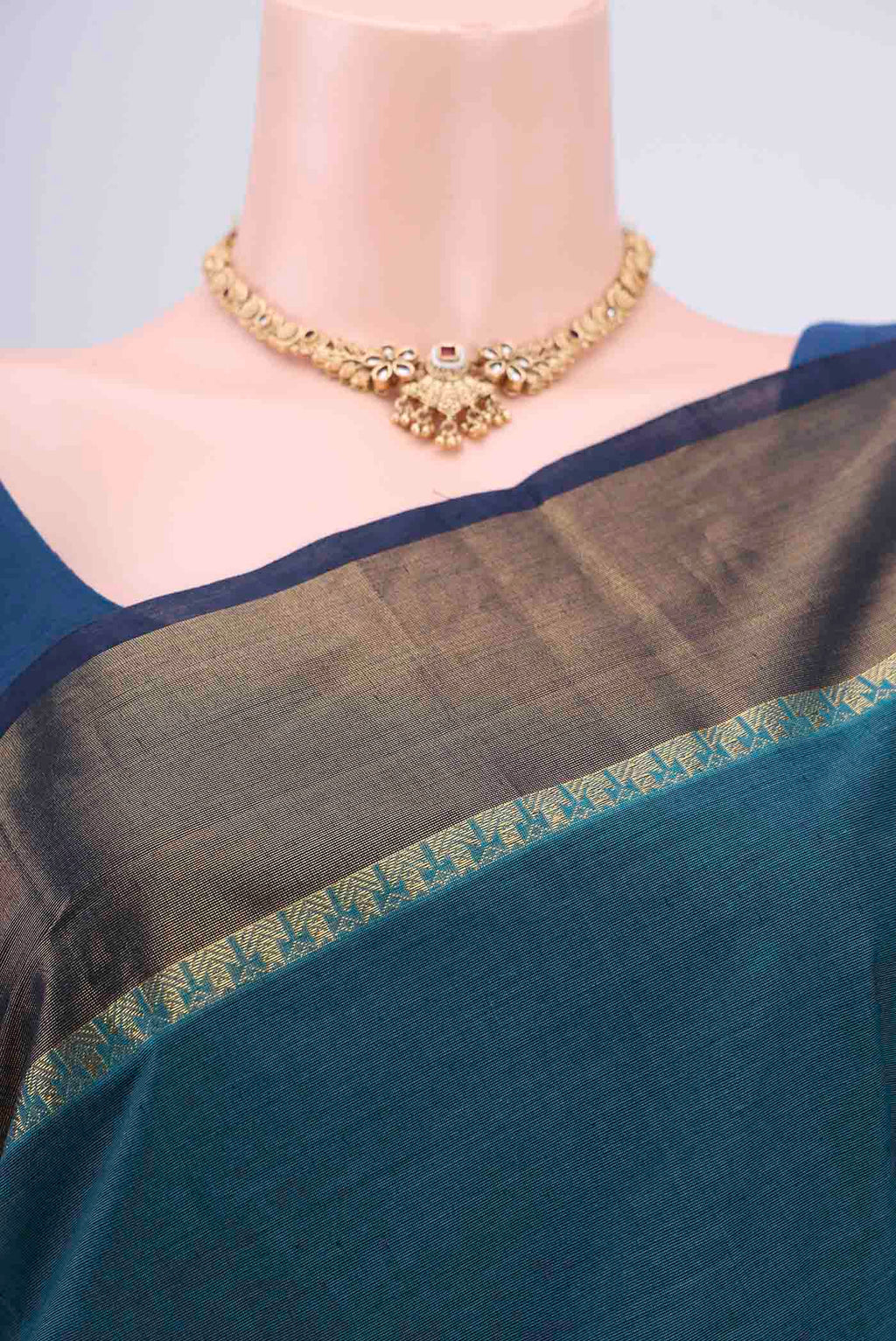 Border image of Blue Kanchi Cotton Saree with Thread Butta on the body and Zari Border. 