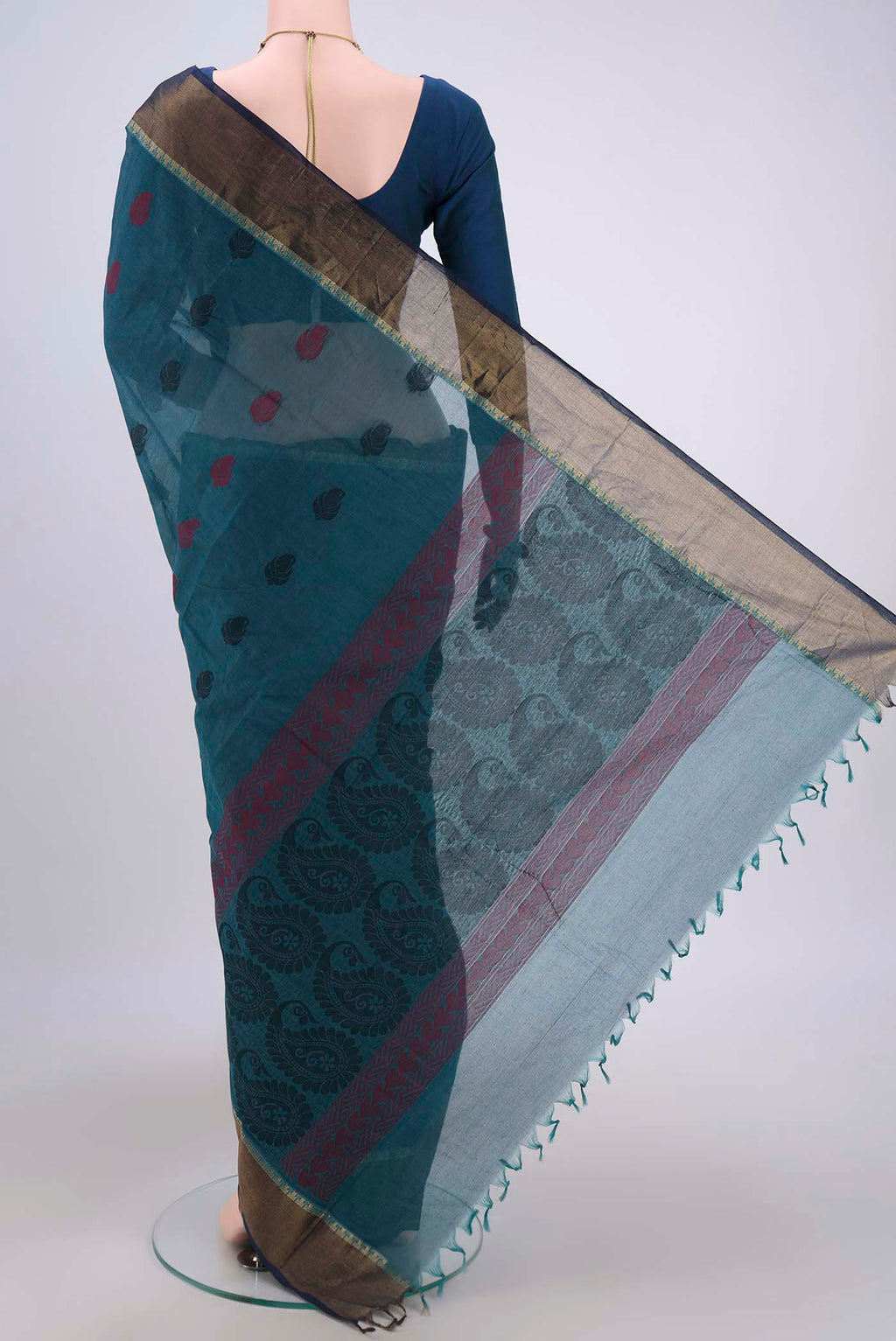 Flat view of Blue Kanchi Cotton Saree with Thread Butta on the body and Zari Border. 