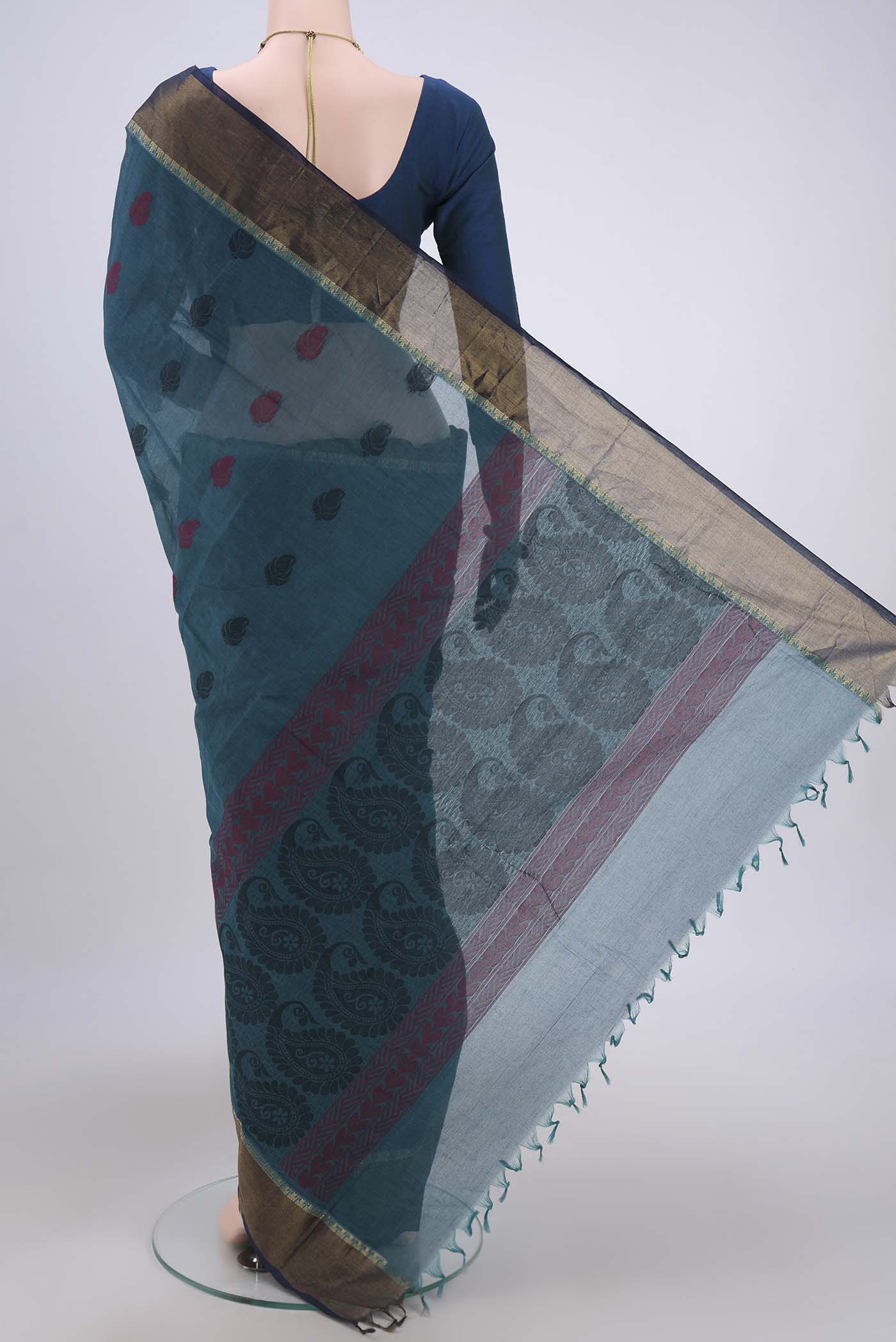 Flat view of Blue Kanchi Cotton Saree with Thread Butta on the body and Zari Border. 