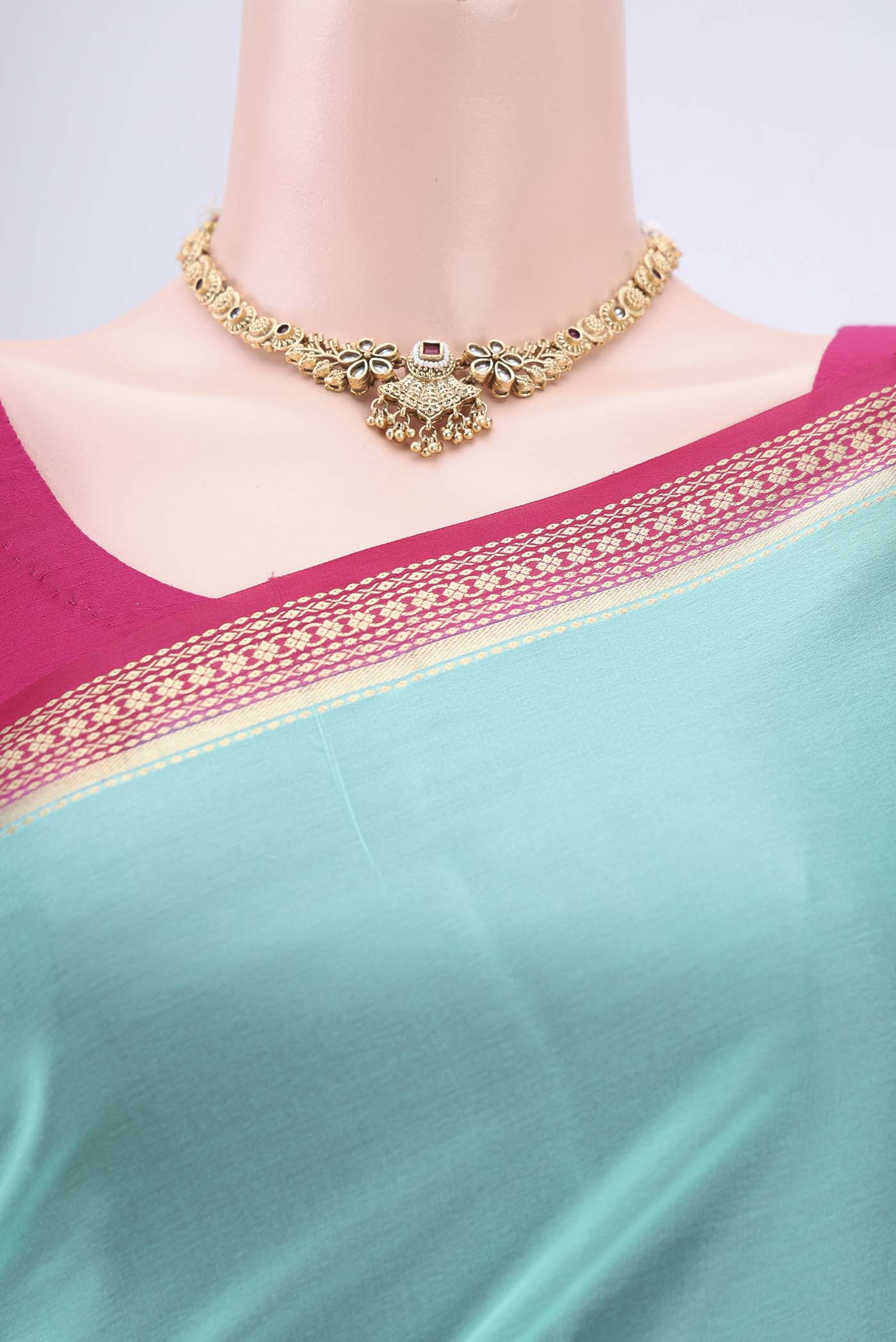 Border image of Mint Green Mysore Crepe Saree with Plain Body and Zari Border. 