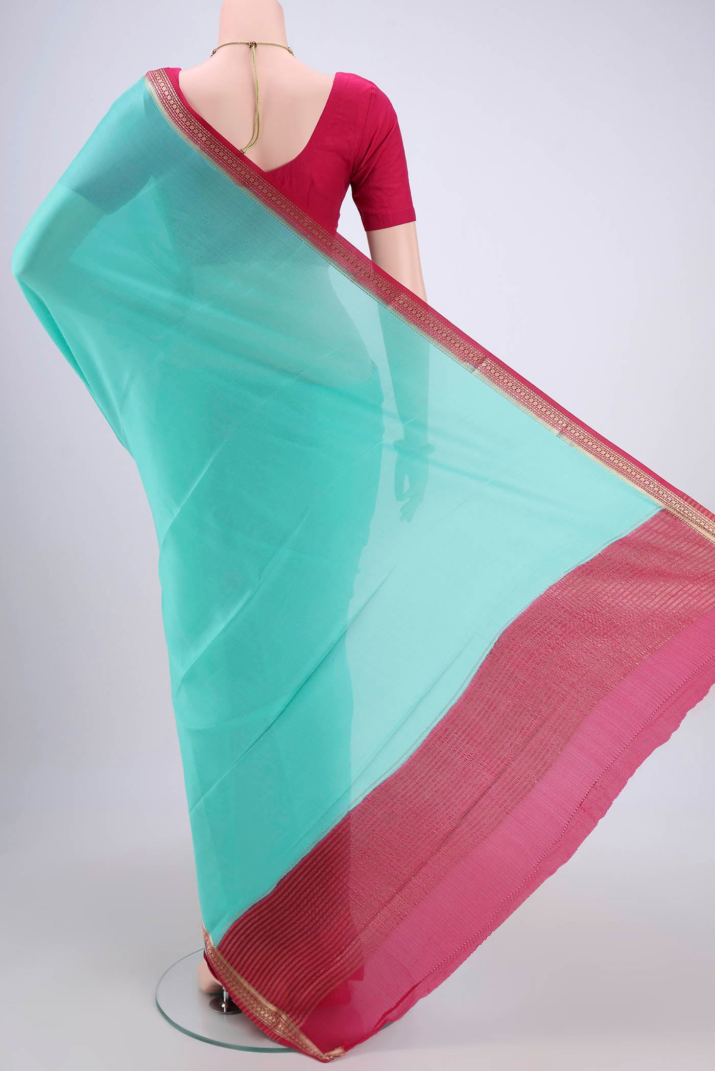 Flat view of Mint Green Mysore Crepe Saree with Plain Body and Zari Border. 