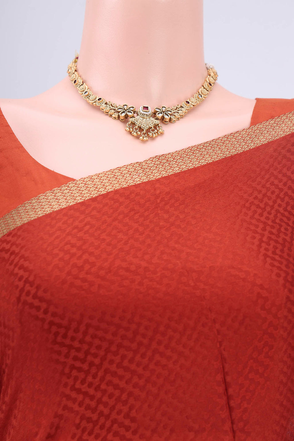 Border image of Rust Mysore Crepe Saree with Jacquard design on the body and Zari Border. 