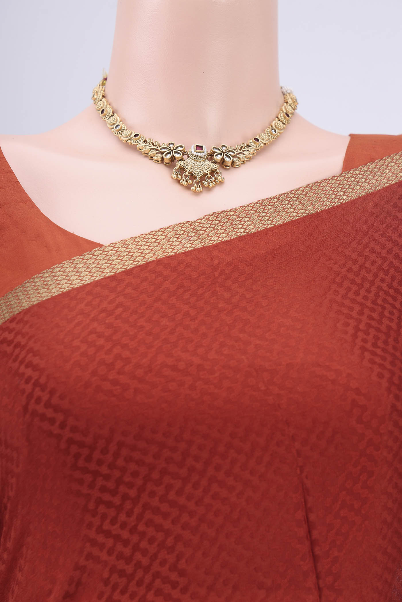 Border image of Rust Mysore Crepe Saree with Jacquard design on the body and Zari Border. 