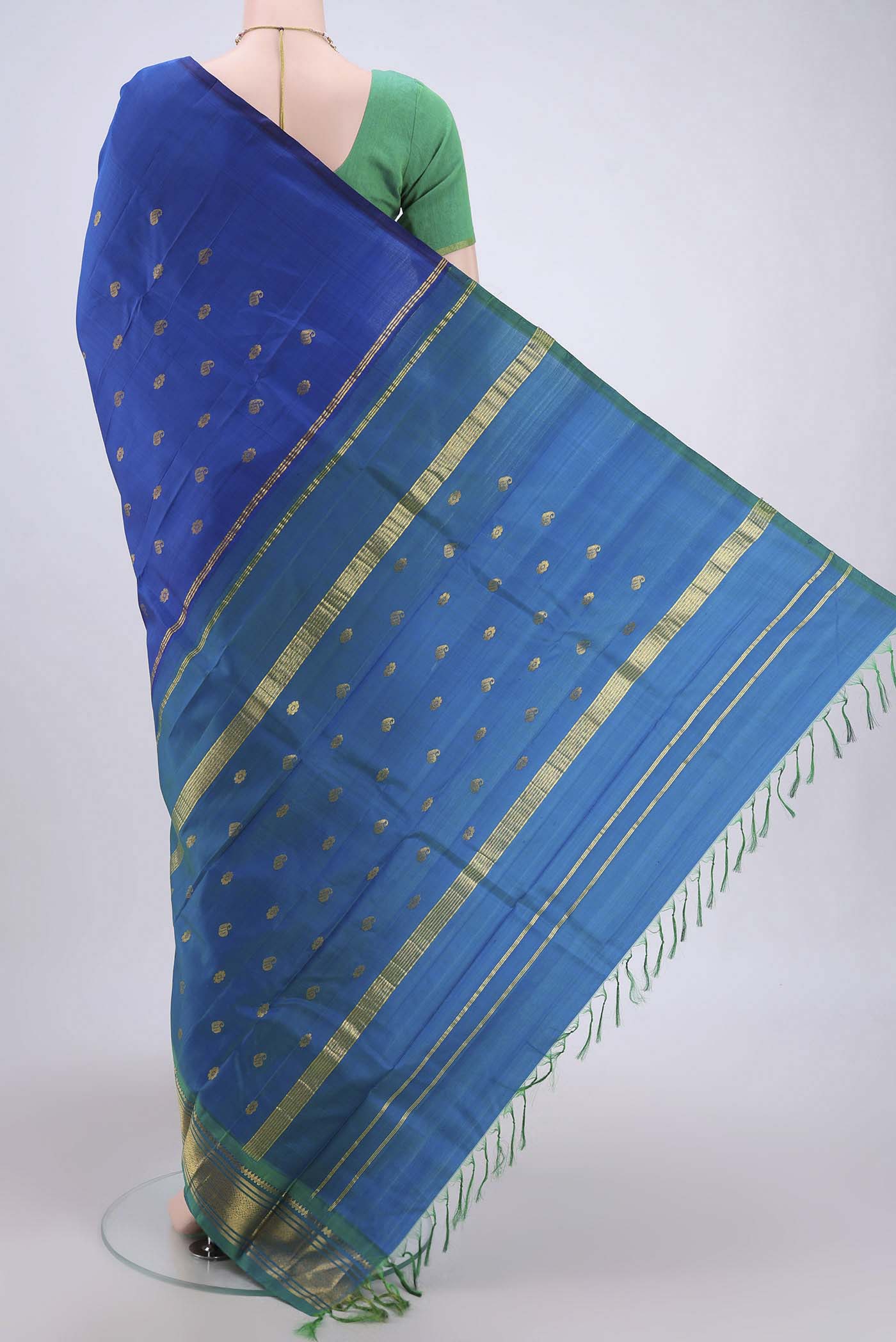 Flat view of Dark Blue Dual Tone Kanjivaram Silk Saree with Zari Butta on the body and One Side Border. 