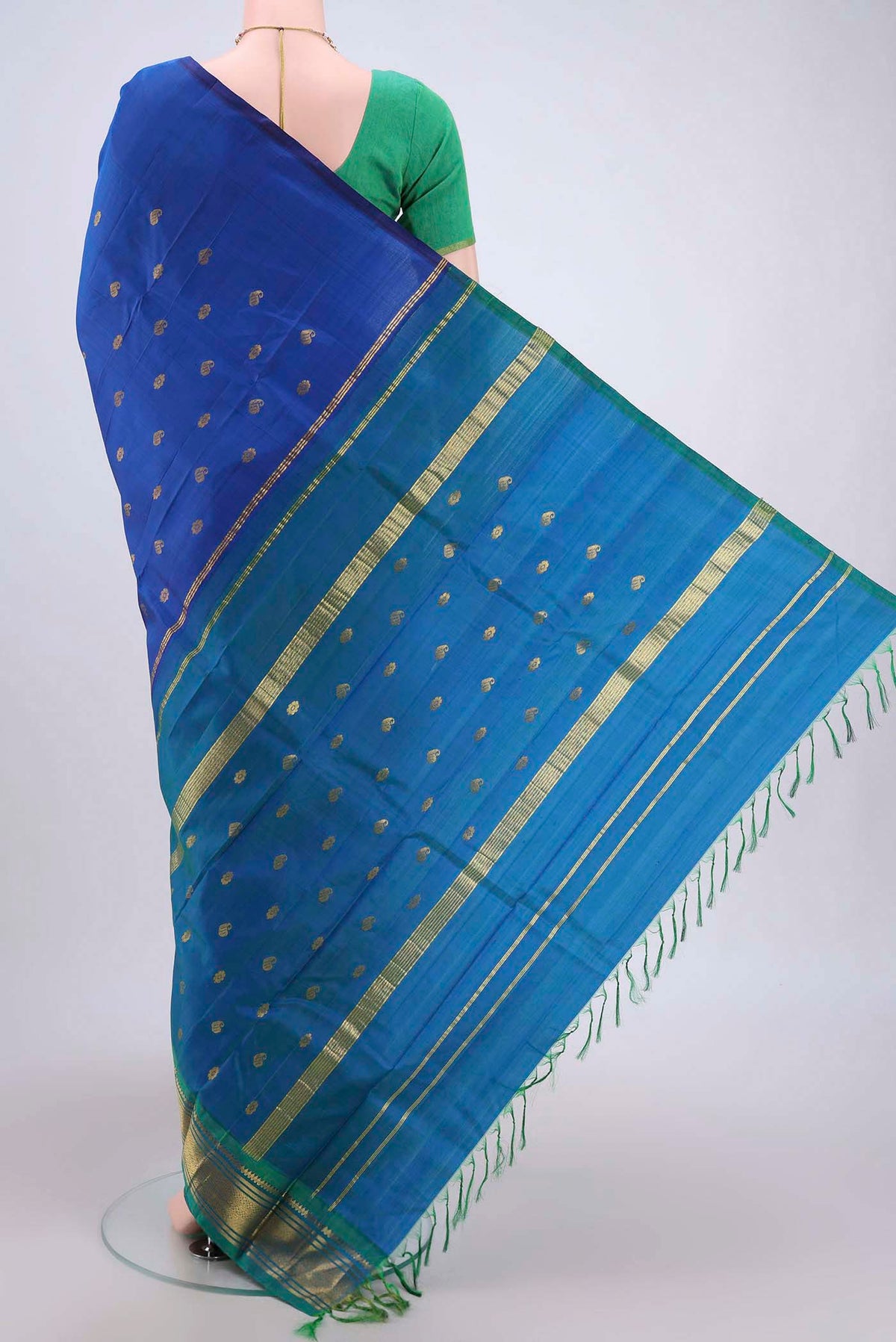 Flat view of Dark Blue Dual Tone Kanjivaram Silk Saree with Zari Butta on the body and One Side Border. 