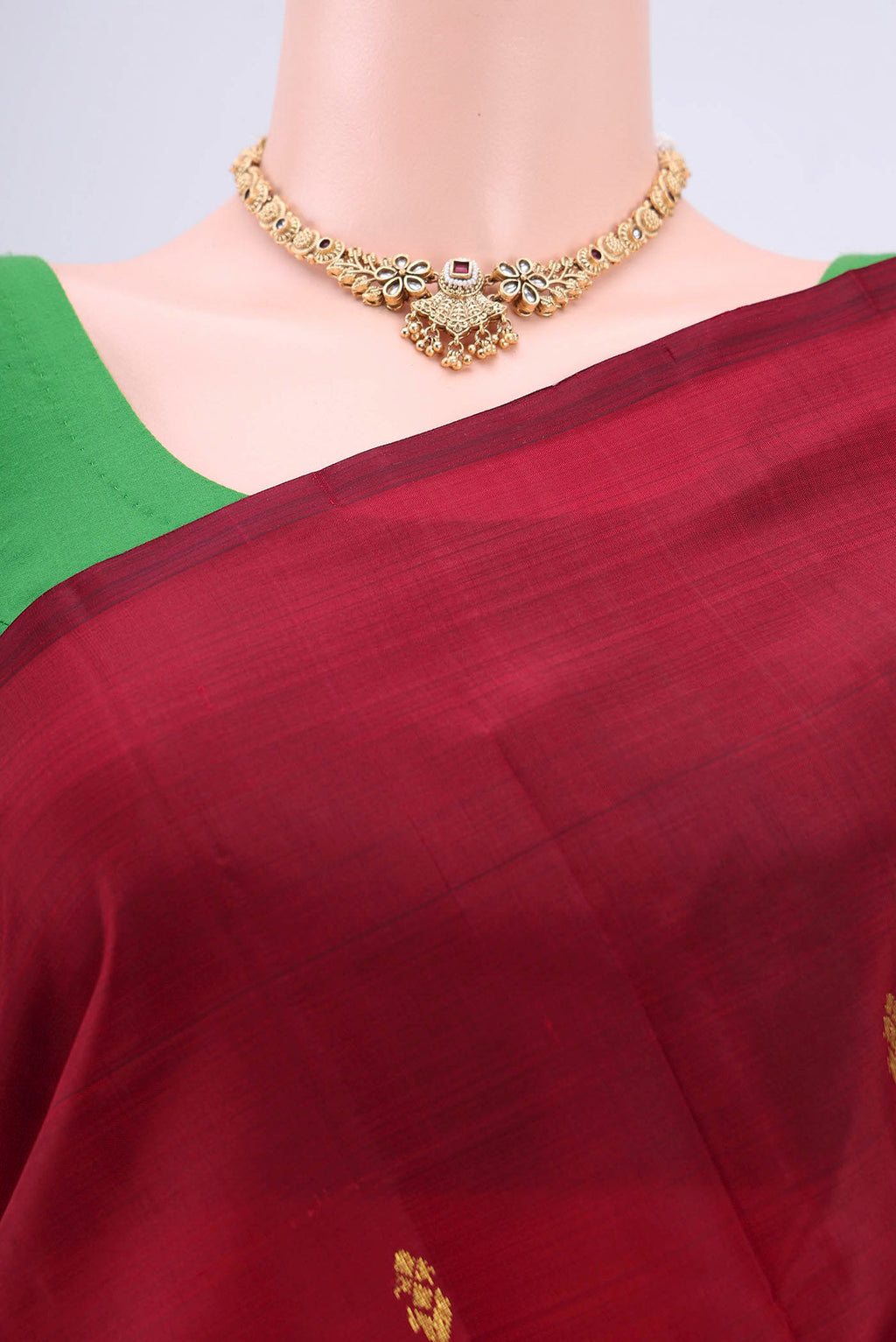 Border image of Maroon Kanjivaram Silk Saree with Zari Butta on the body and One Side Border. 