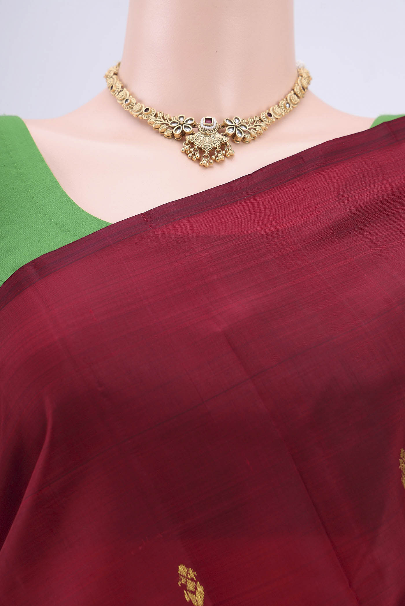 Border image of Maroon Kanjivaram Silk Saree with Zari Butta on the body and One Side Border. 