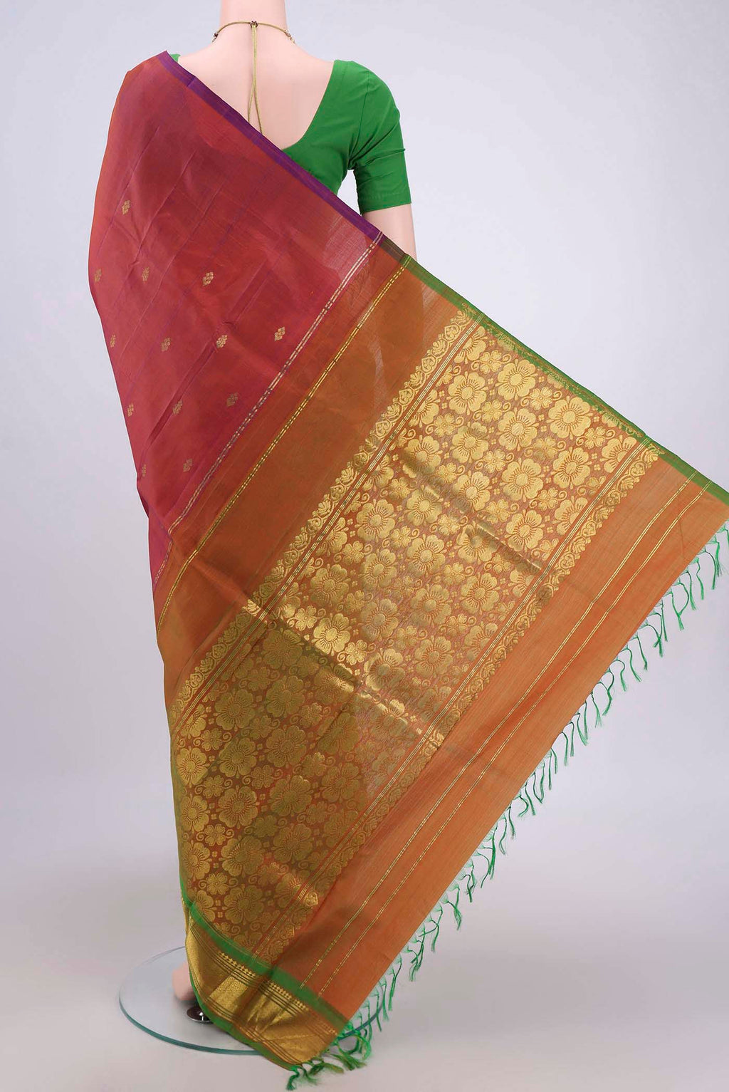 Flat view of Rust Dual Tone Kanjivaram Silk Saree with Zari Butta on the body and One Side Border. 
