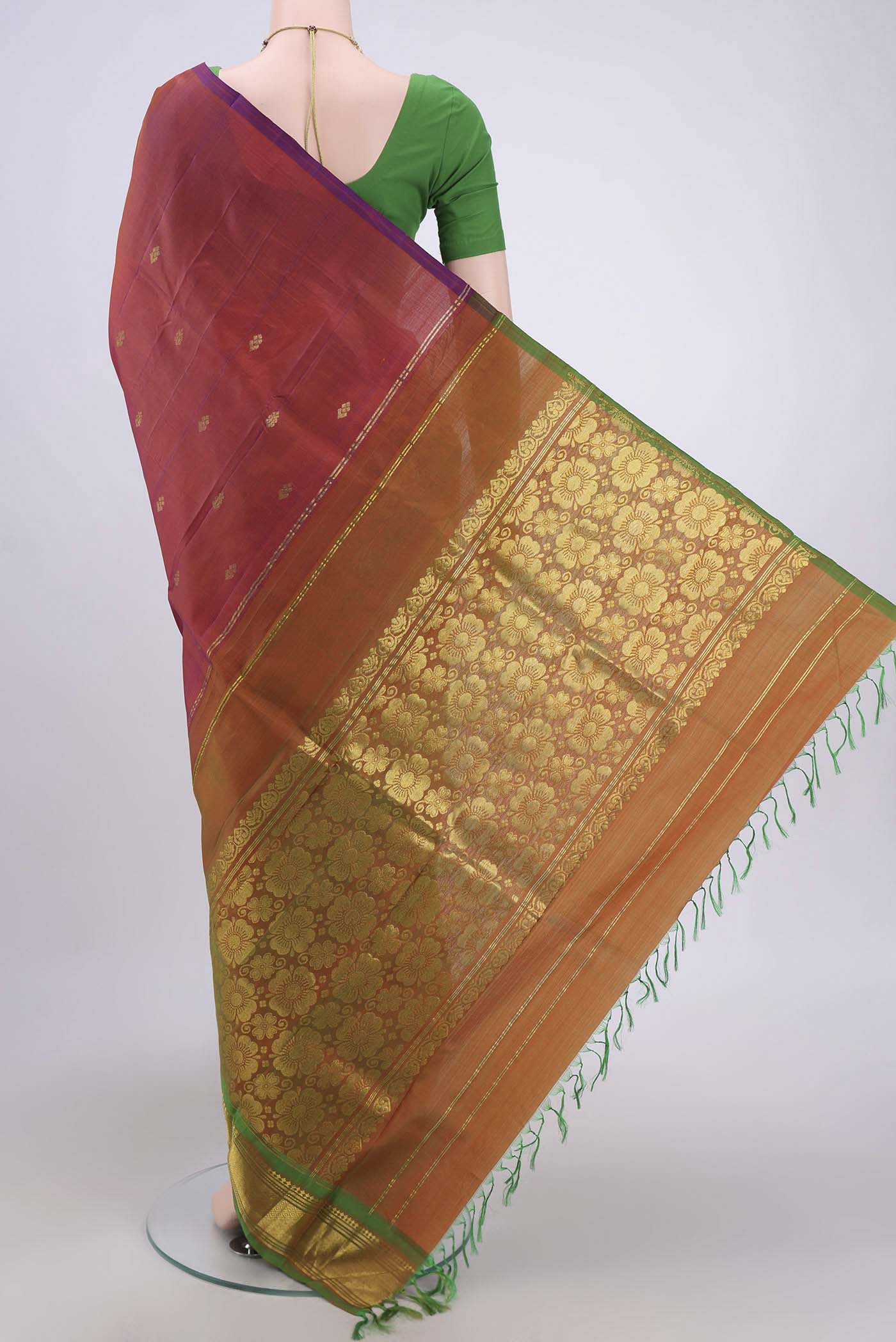 Flat view of Rust Dual Tone Kanjivaram Silk Saree with Zari Butta on the body and One Side Border. 
