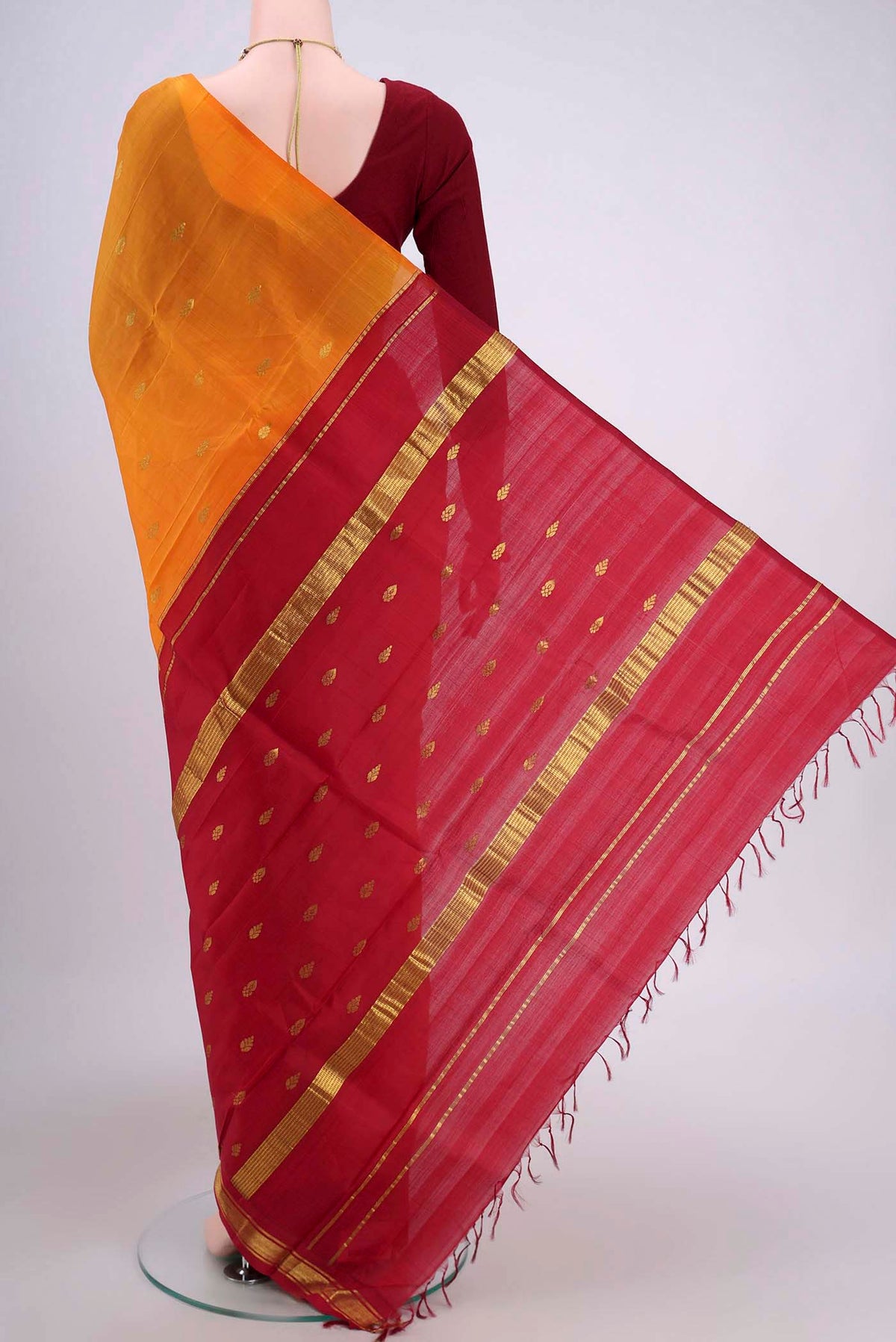 Flat view of Yellow Dual Tone Kanjivaram Silk Saree with Zari Butta on the body and One Side Border. 