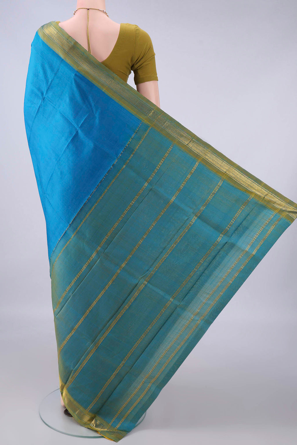 Flat view of Pure Silk Electric Blue Kanjivaram Saree with Plain Body and Zari Border. 