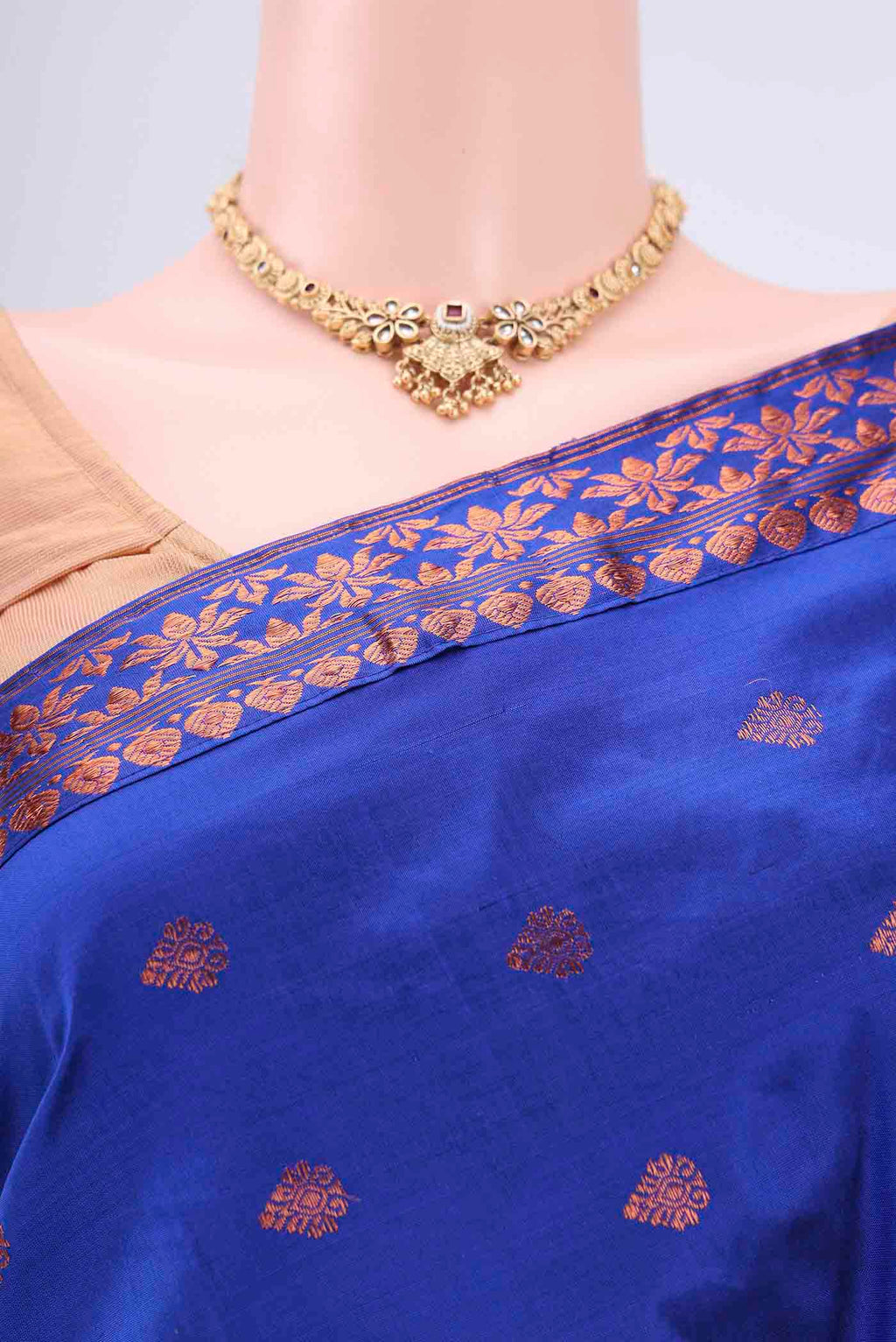 Border image of Navy Blue Assam Silk Saree with Zari Butta on the body and Zari Border. 