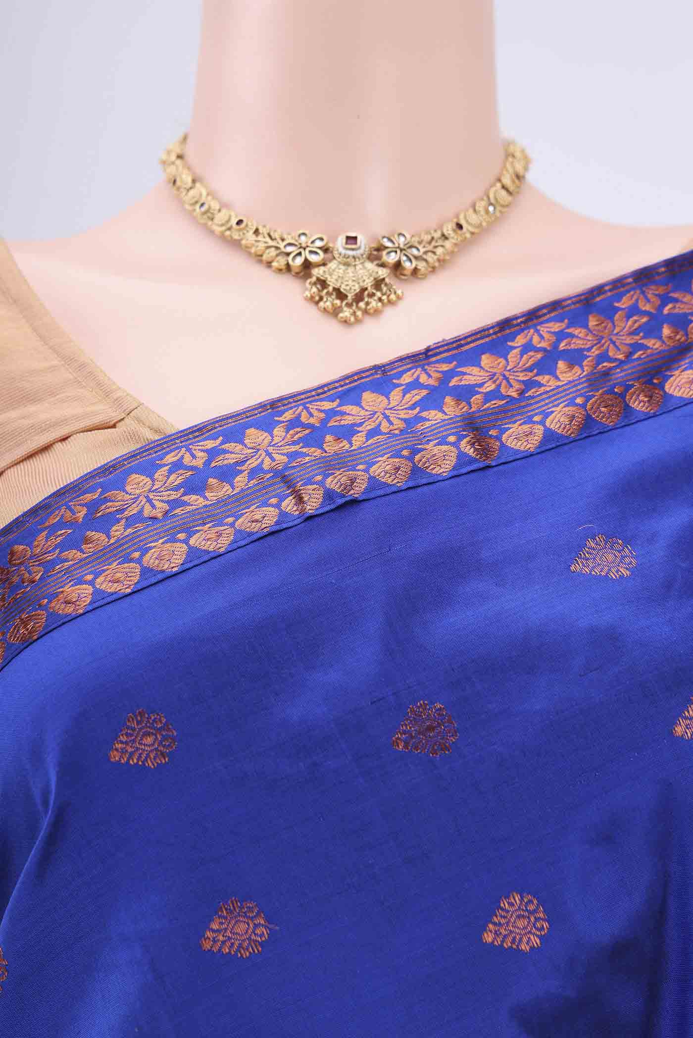 Border image of Navy Blue Assam Silk Saree with Zari Butta on the body and Zari Border. 