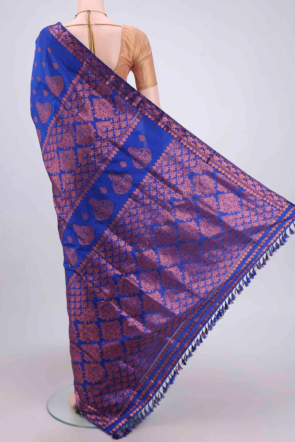 Flat view of Navy Blue Assam Silk Saree with Zari Butta on the body and Zari Border. 