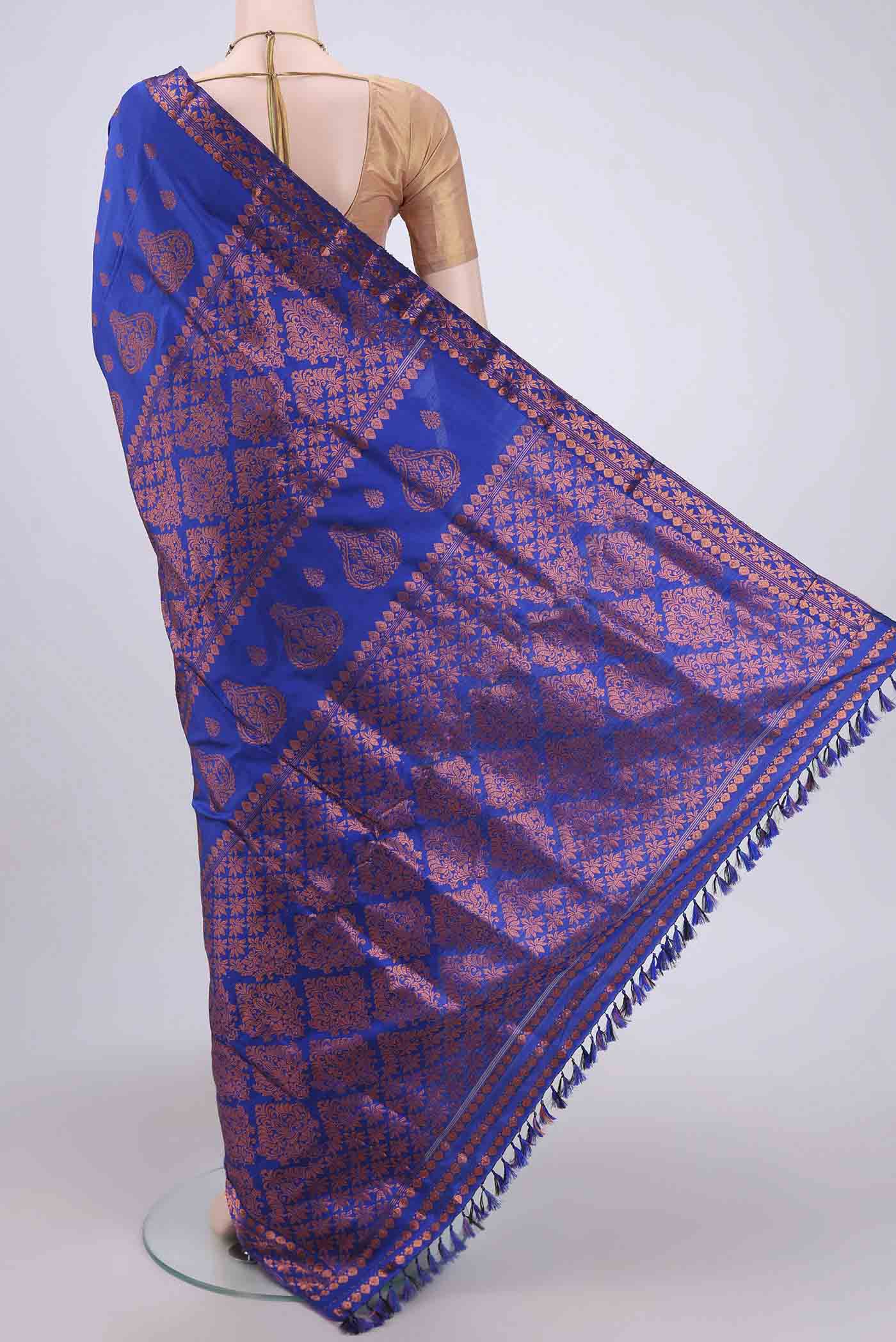 Flat view of Navy Blue Assam Silk Saree with Zari Butta on the body and Zari Border. 