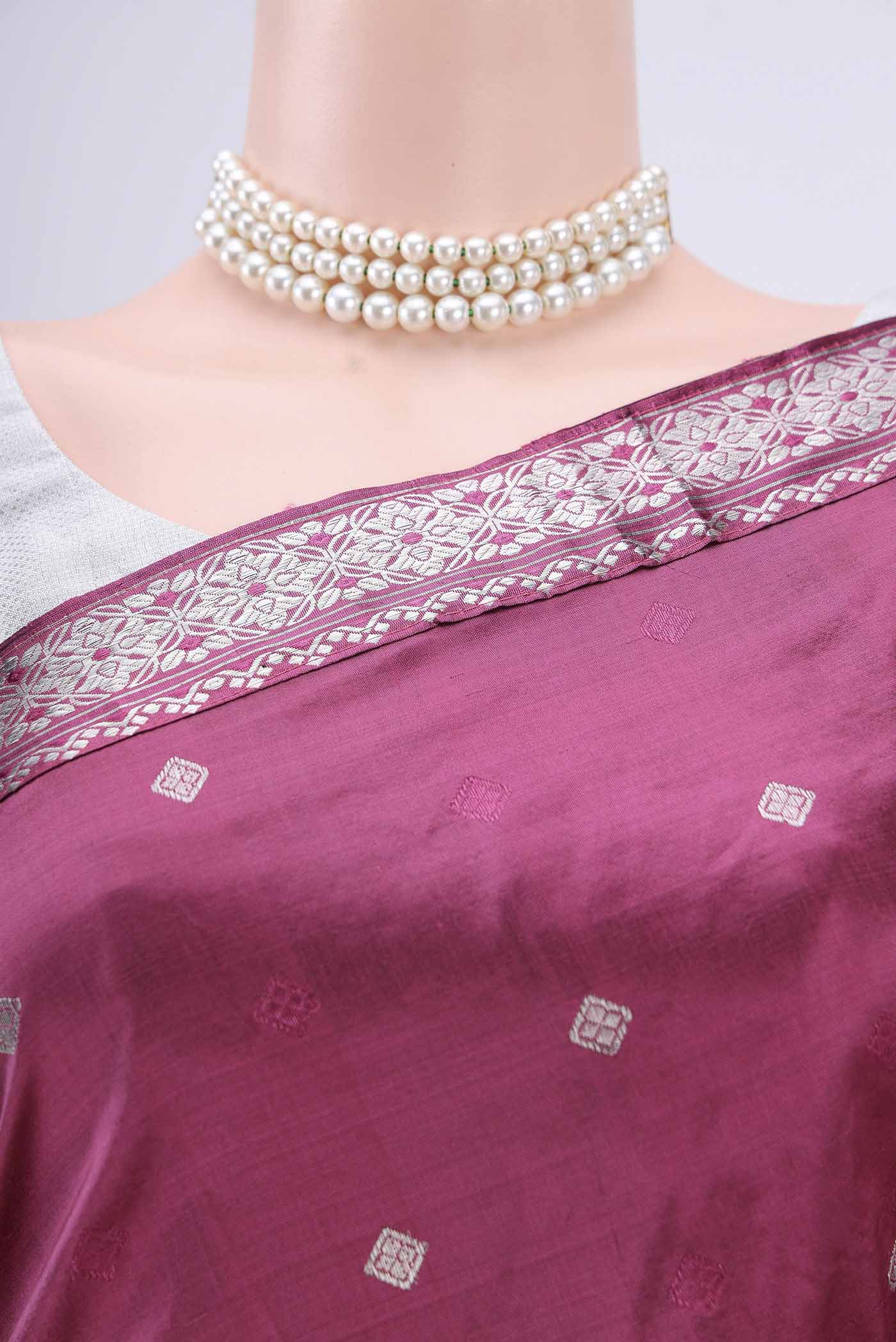 Border image of Pink Assam Silk Saree with Zari Butta on the body and Zari Border. 