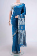 Turquoise Assam Silk Saree with Zari Butta on the body and Zari Border.  displayed on a mannequin
