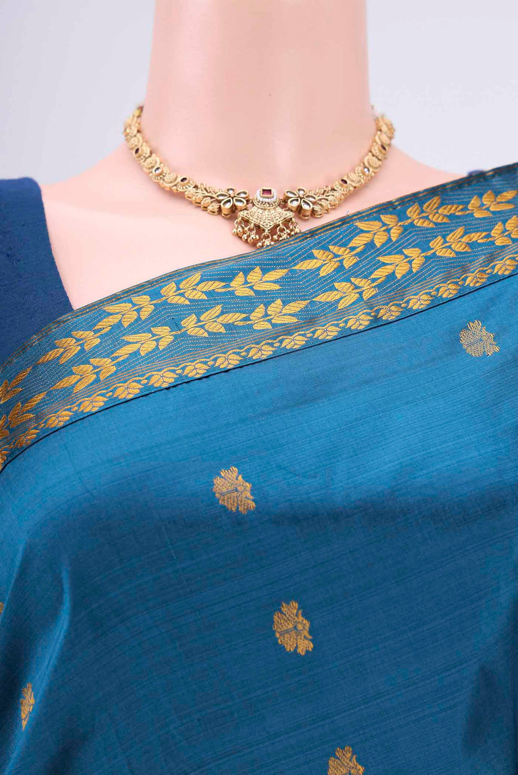 Border image of Blue Assam Silk Saree with Zari Butta on the body and Zari Border. 