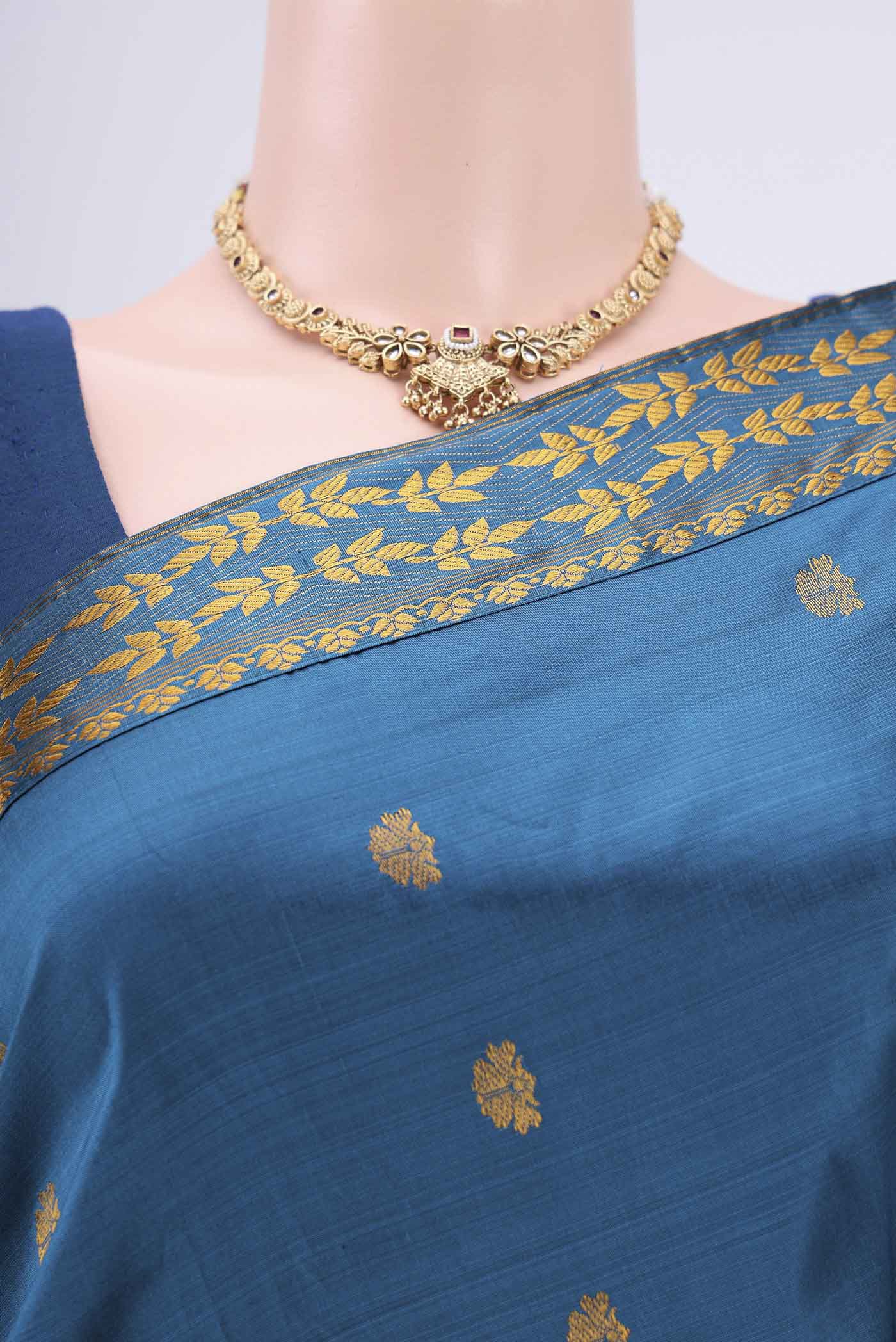 Border image of Blue Assam Silk Saree with Zari Butta on the body and Zari Border. 