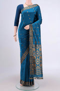 Blue Assam Silk Saree with Zari Butta on the body and Zari Border.  displayed on a mannequin