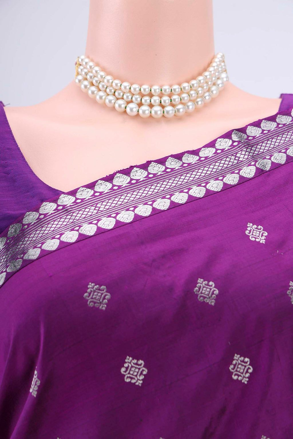 Border image of Purple Assam Silk Saree with Zari Butta on the body and Zari Border. 