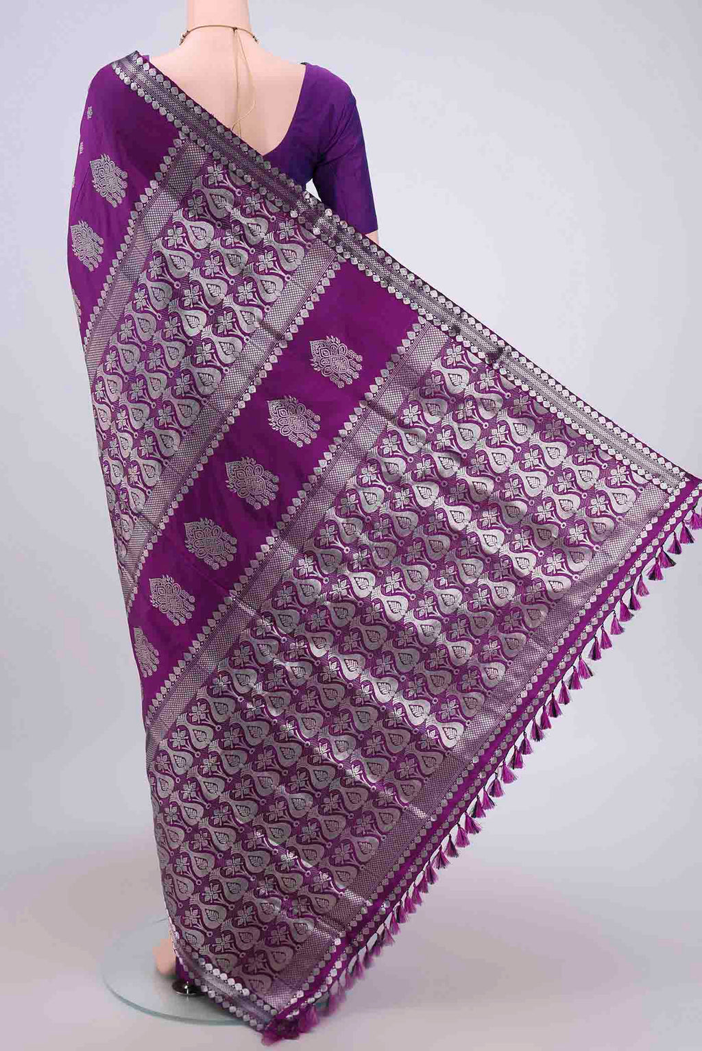 Flat view of Purple Assam Silk Saree with Zari Butta on the body and Zari Border. 