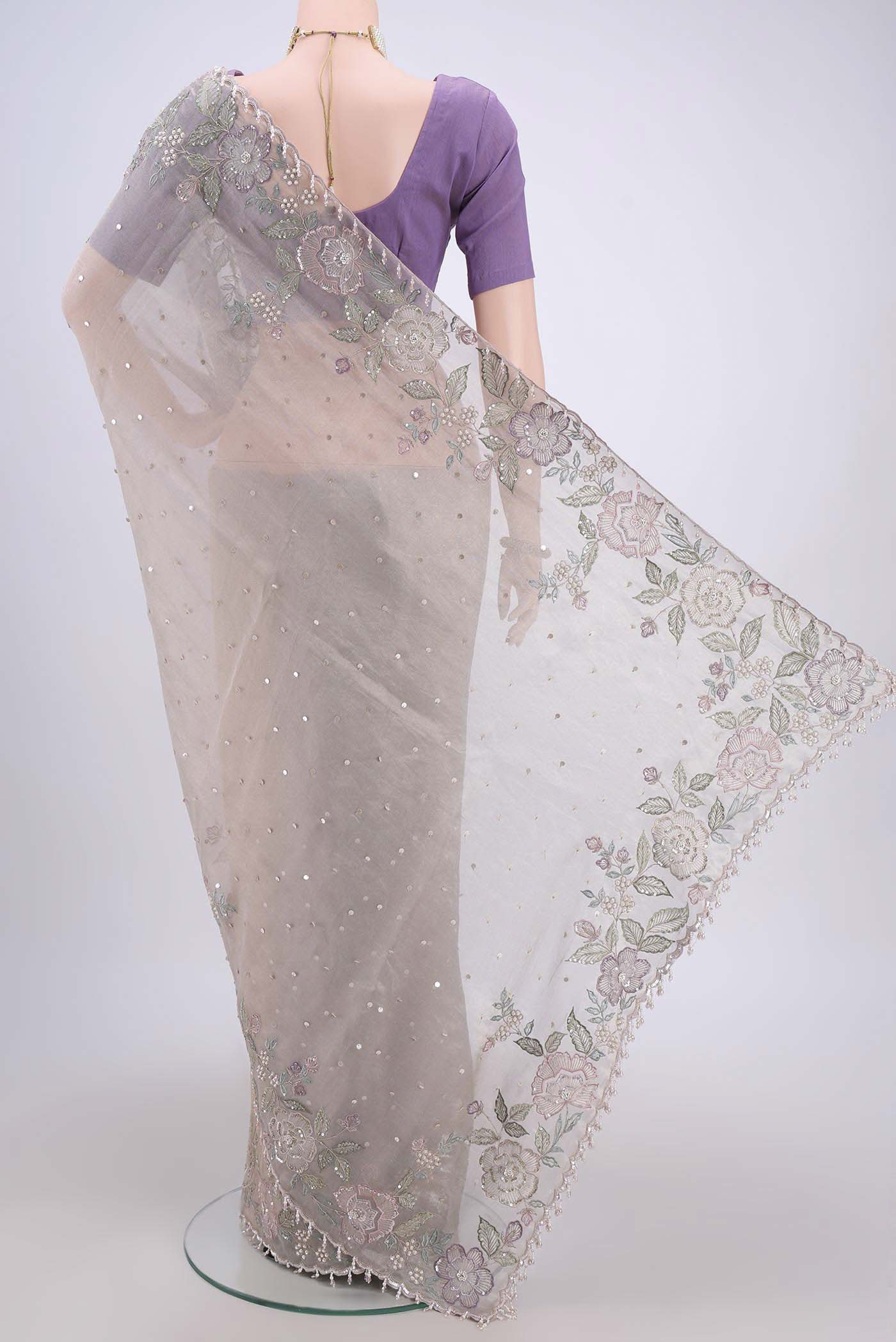 Flat view of Mauve Dual Tone Organza Silk Saree with Embroidery on the body and Zari Border. 