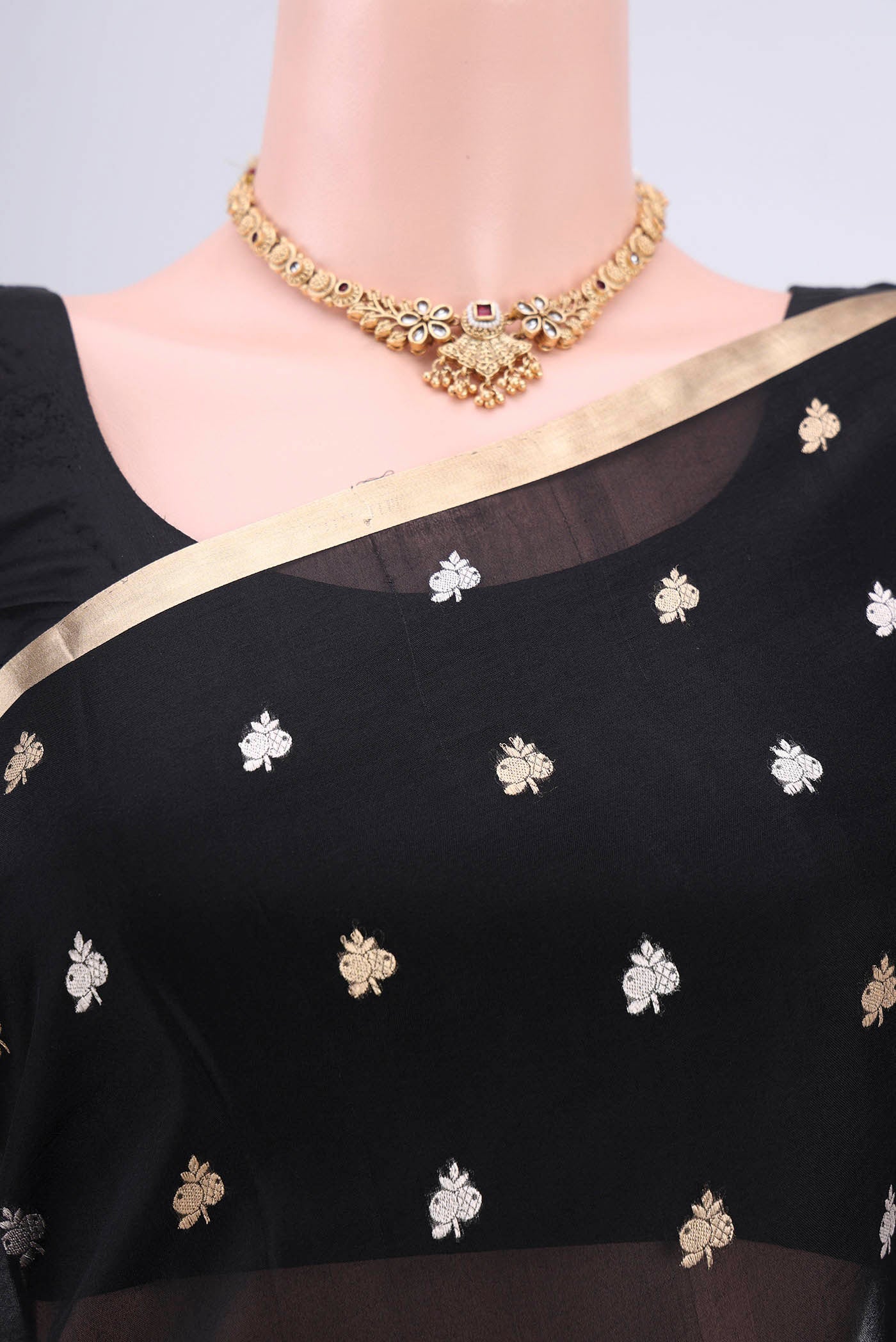 Border image of Black Banarasi Katan Silk Saree with Zari Butta on the body and Zari Border. 