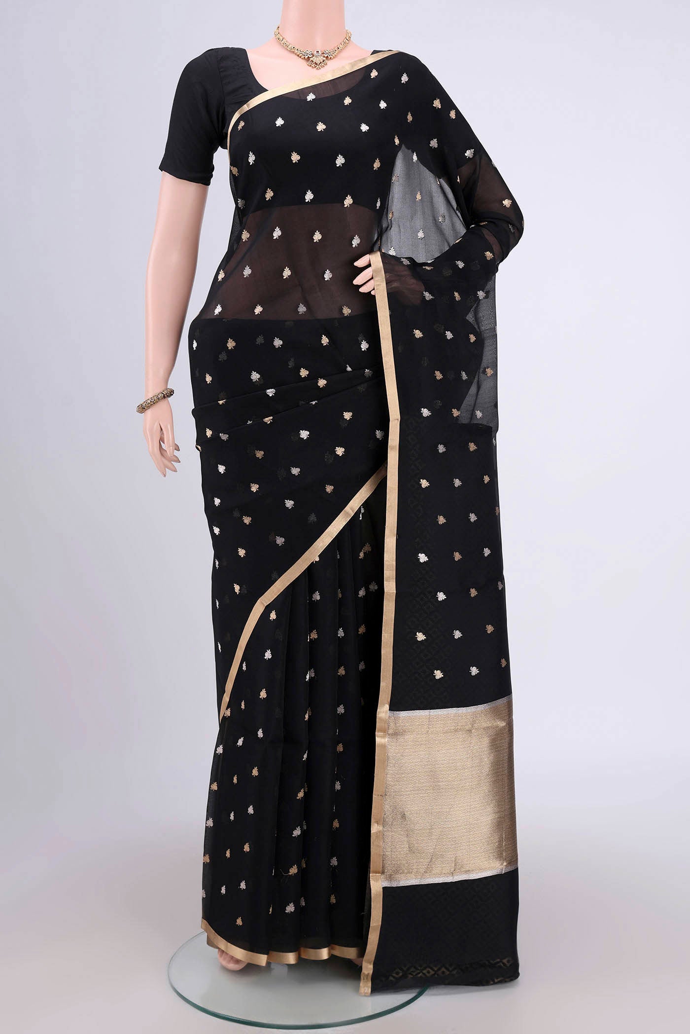 Black Banarasi Katan Silk Saree with Zari Butta on the body and Zari Border.  displayed on a mannequin