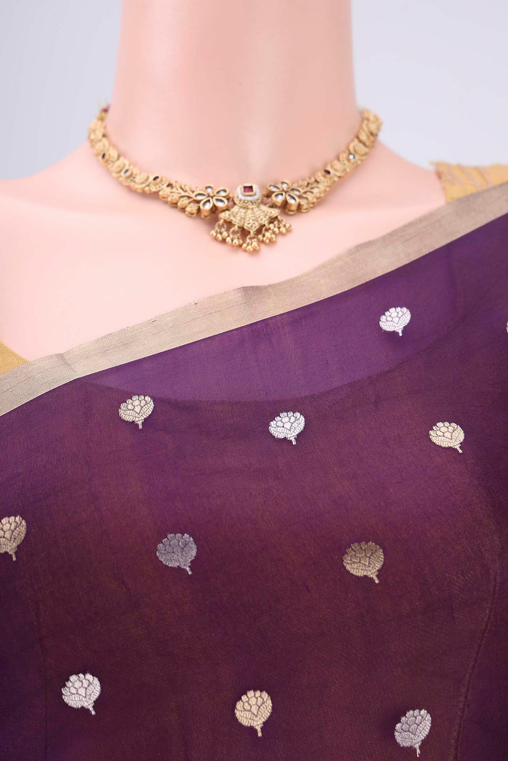 Border image of Purple Organza Silk Saree with Zari Butta on the body and Thin Zari Line. 