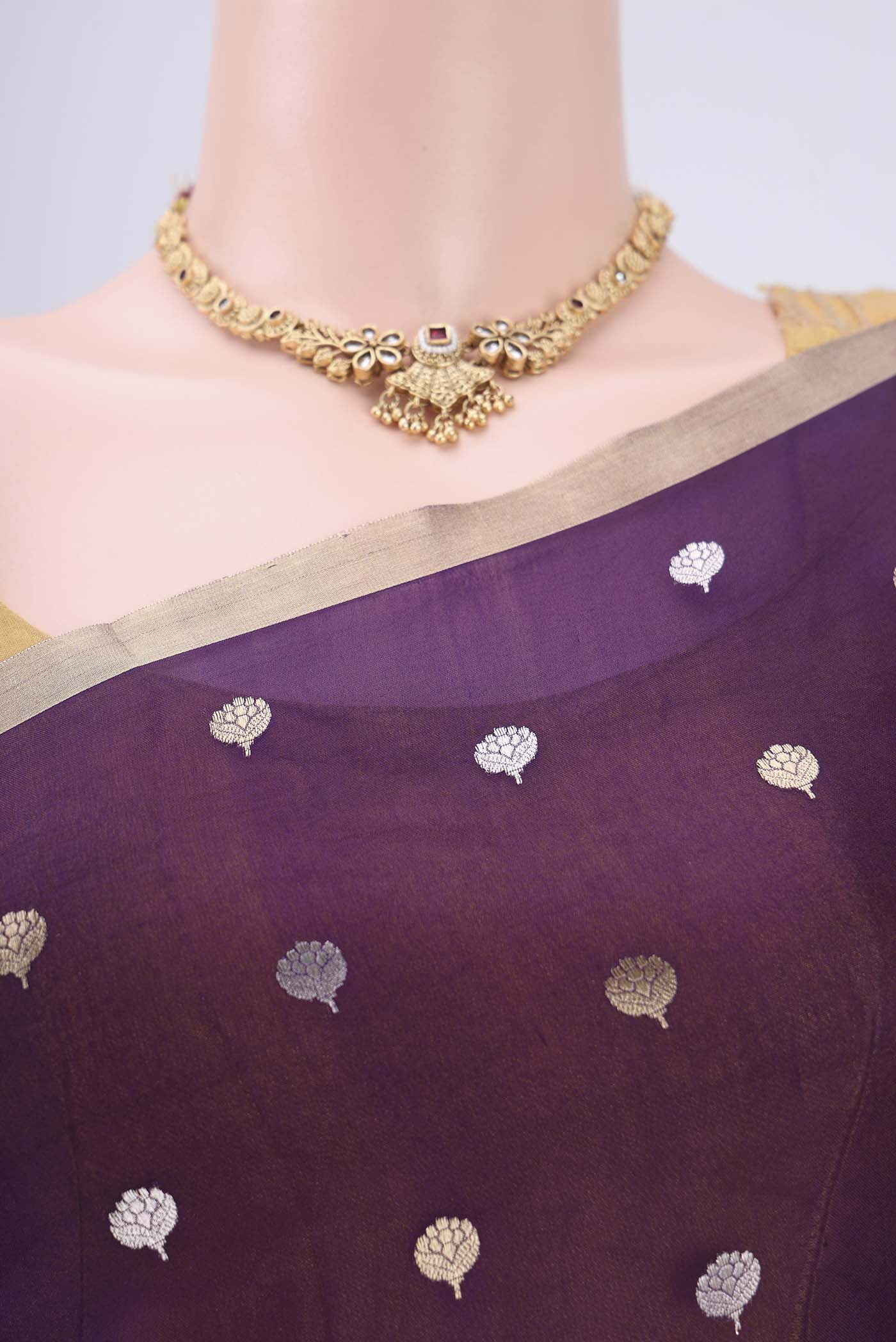 Border image of Purple Organza Silk Saree with Zari Butta on the body and Thin Zari Line. 