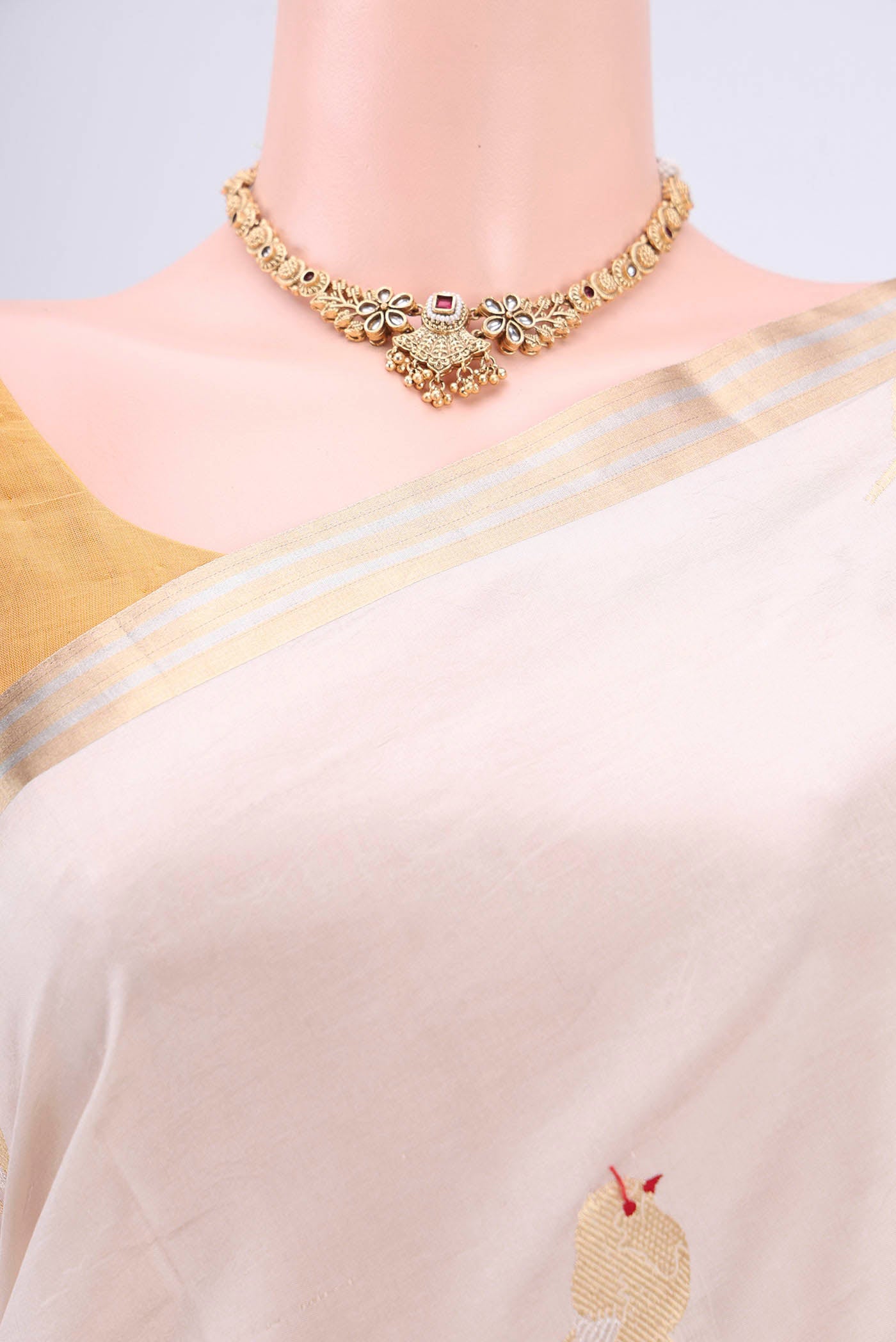 Border image of Cream Banarasi Katan Silk Saree with Zari Butta on the body and Zari Border. 