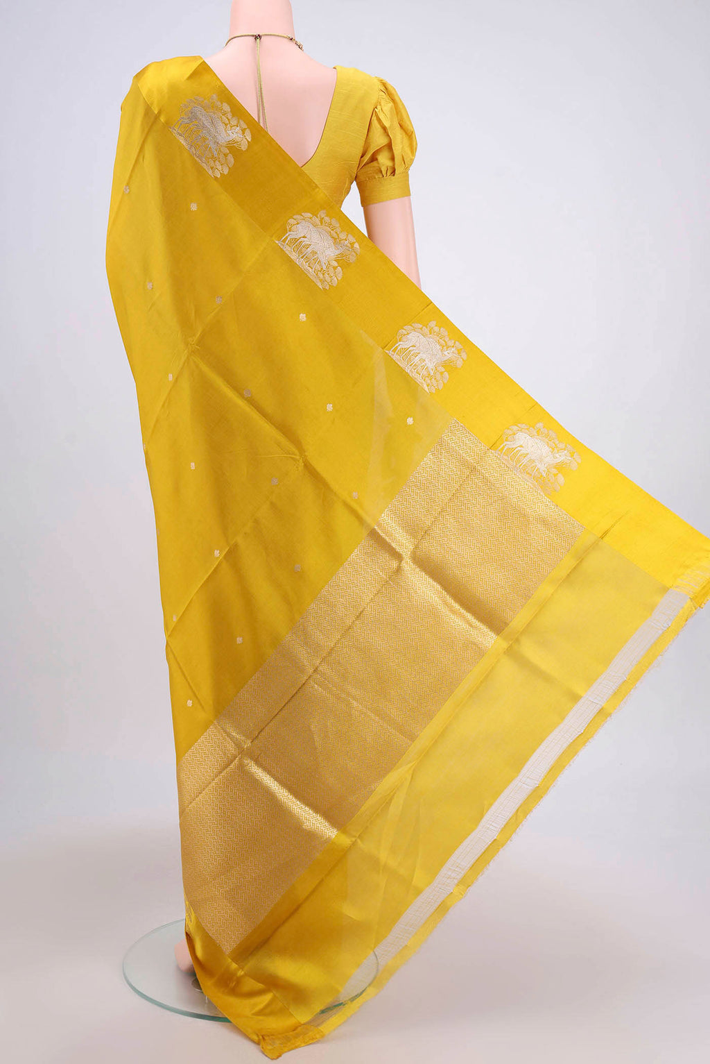 Flat view of Yellow Banarasi Katan Silk Saree with Zari Butta on the body and Zari Border. 