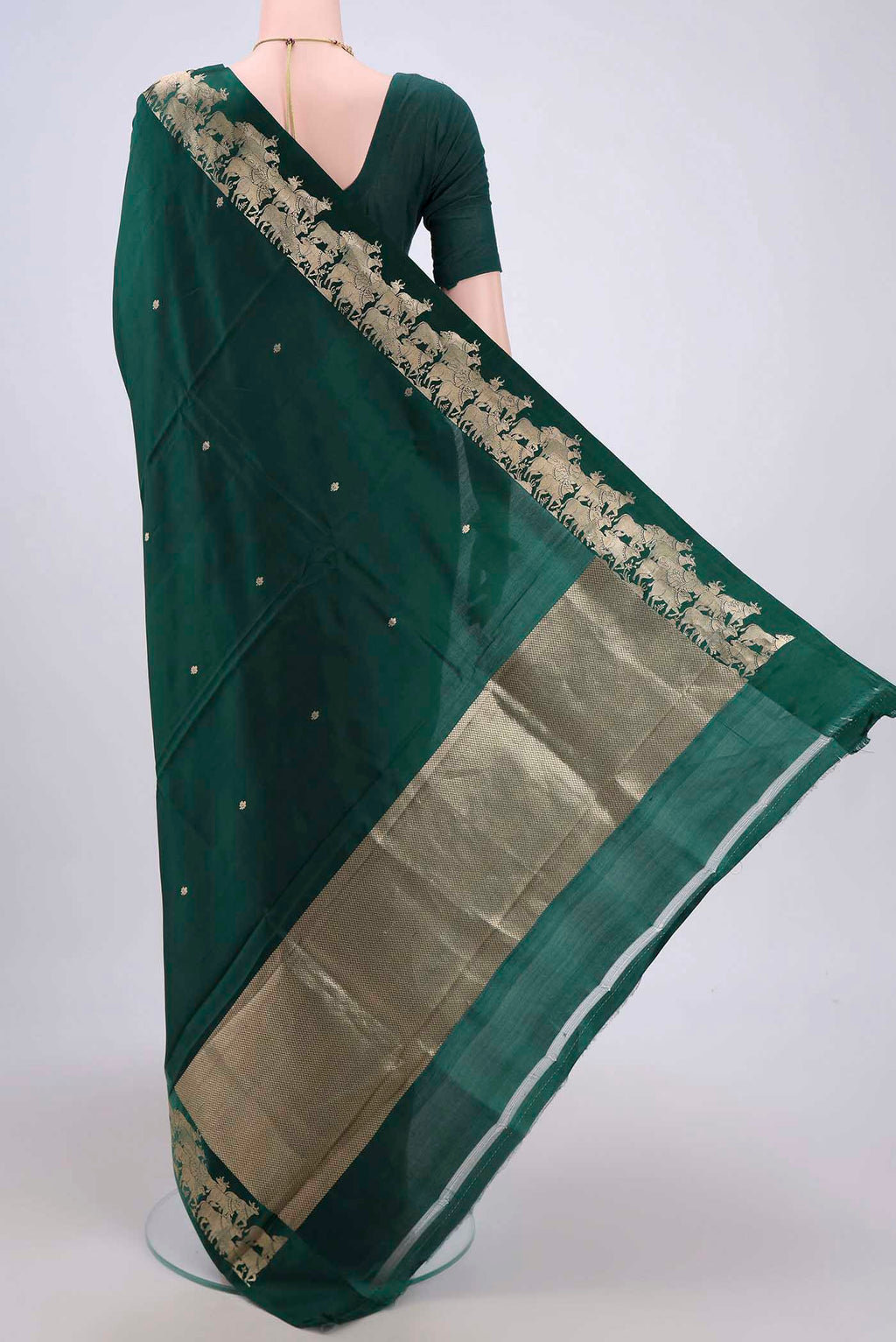 Flat view of Bottle Green Banarasi Katan Silk Saree with Stripes on the body and Zari Border. 