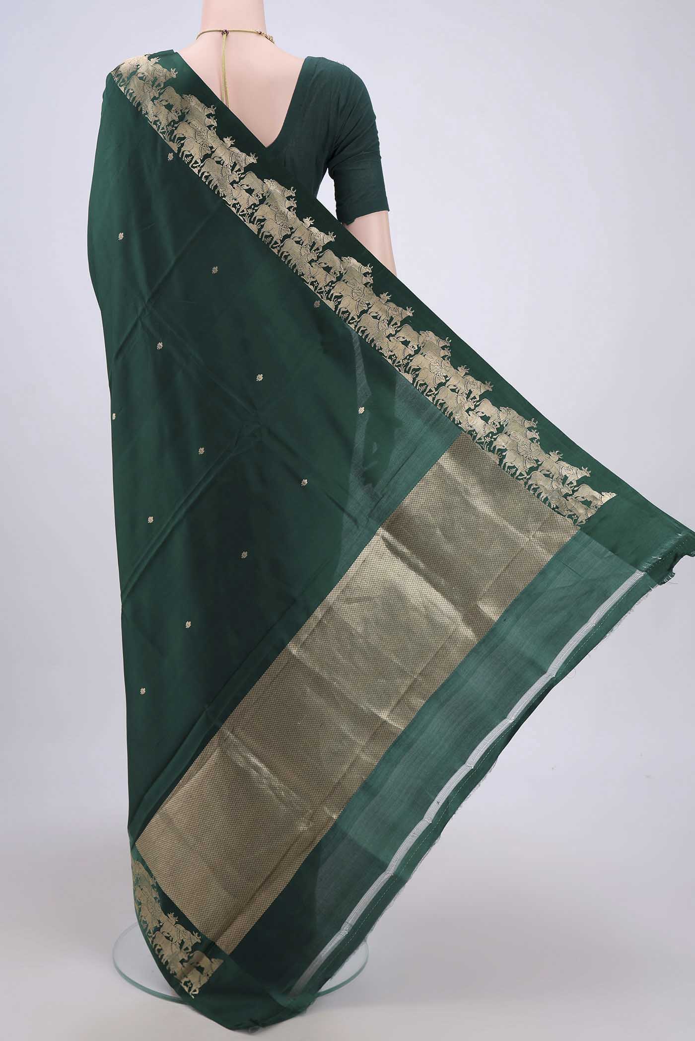 Flat view of Bottle Green Banarasi Katan Silk Saree with Stripes on the body and Zari Border. 